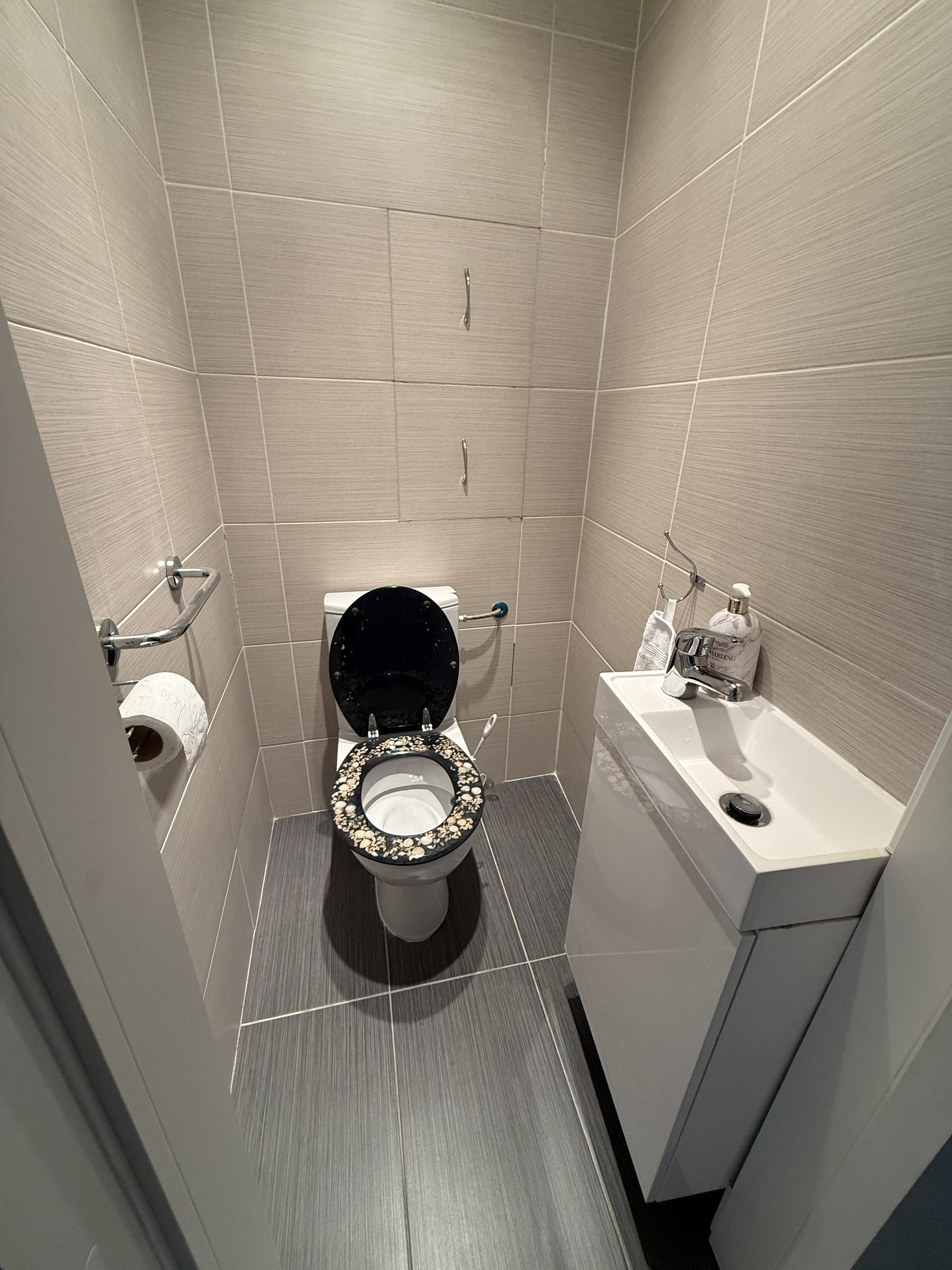 Separate toilet with small sink