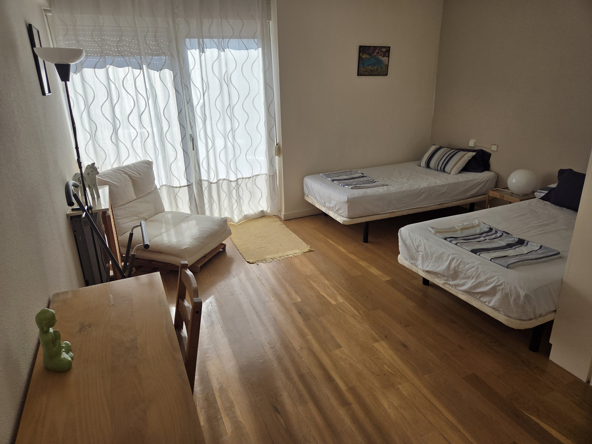 Twin bedroom with balcony access