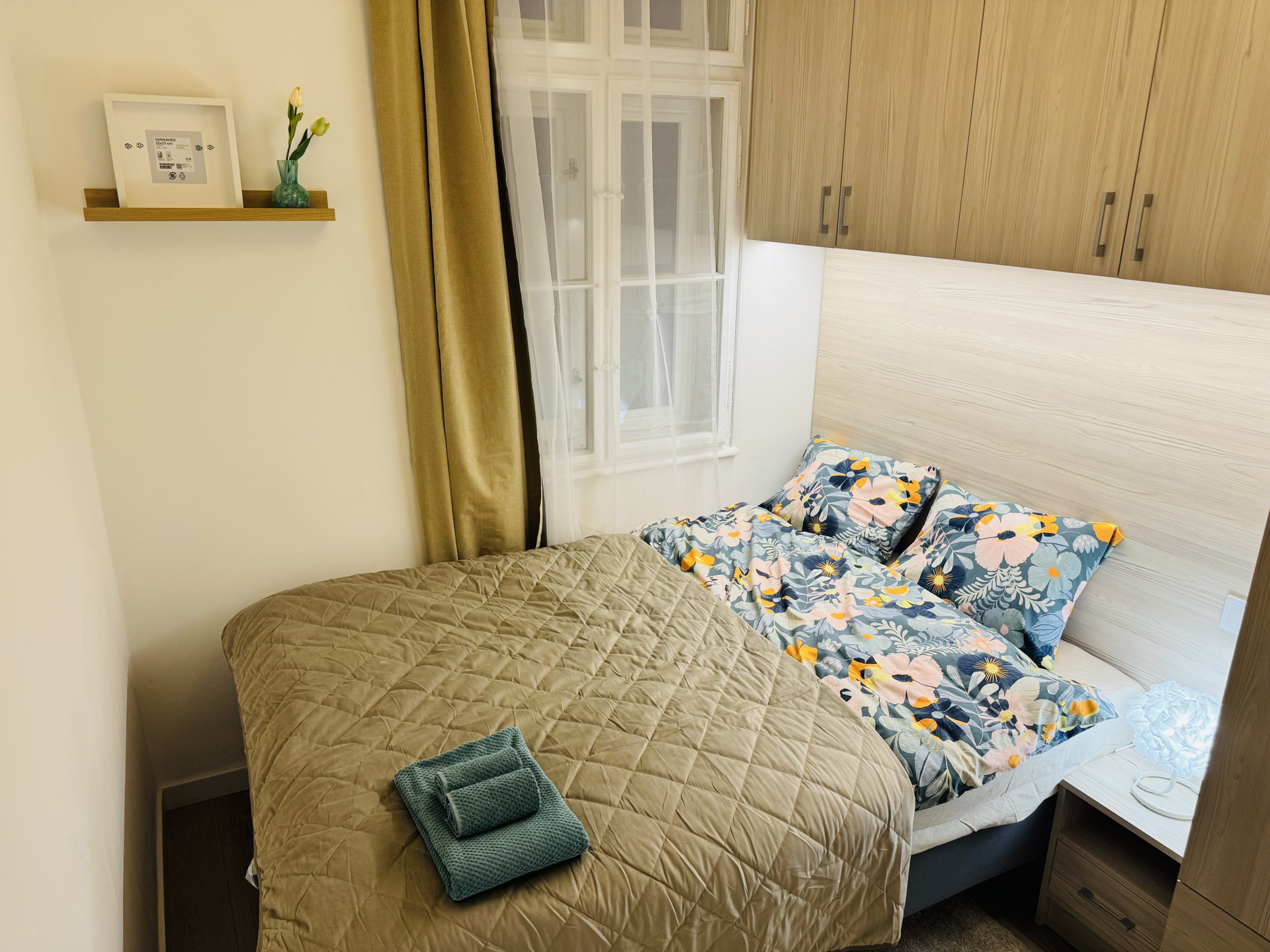 Cozy bedroom with double bed and electric heating