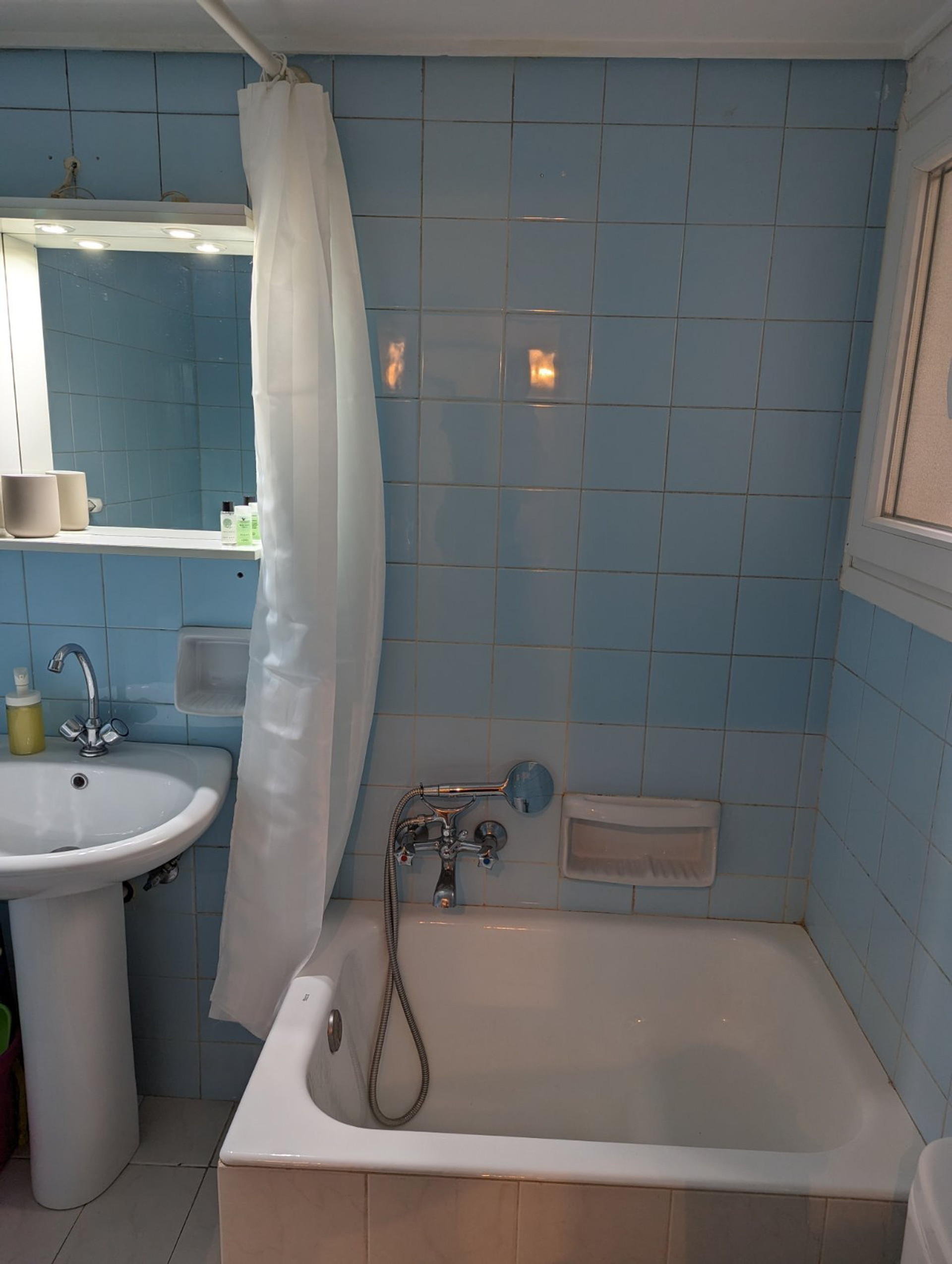 Bathroom with bathtub and sink