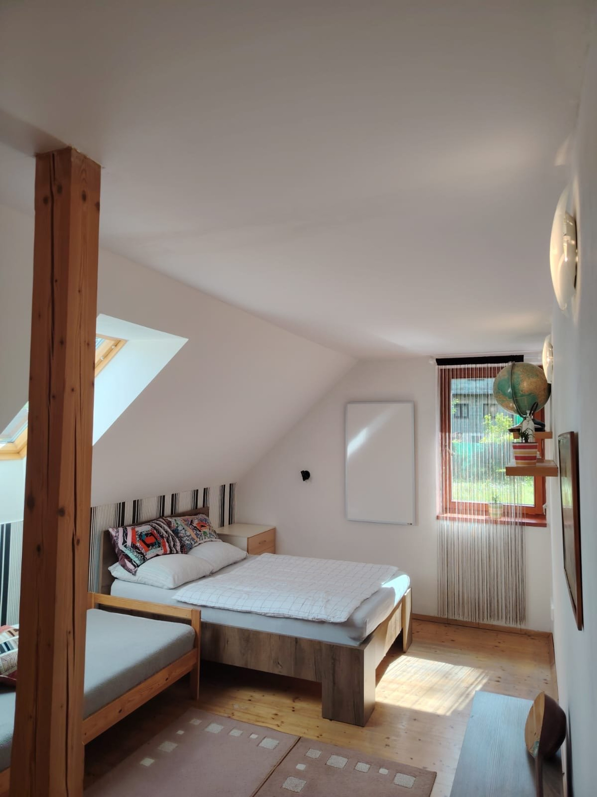 Attic bedroom with wooden beams