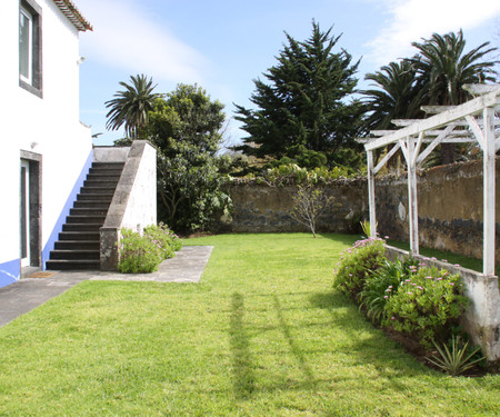 House with large balcony and garden