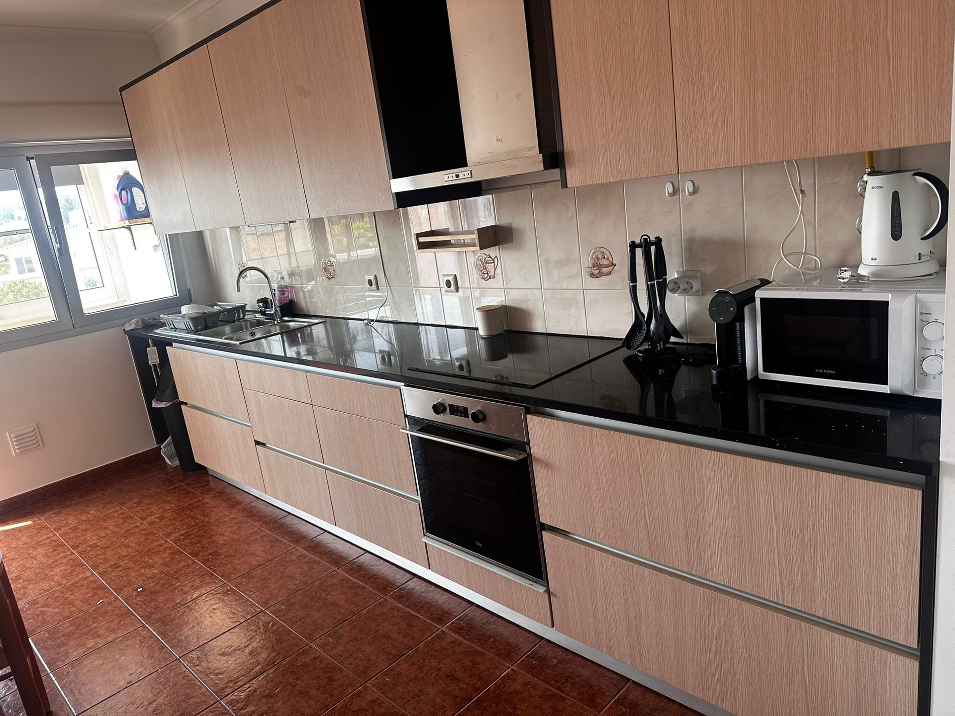 Kitchen with oven and microwave