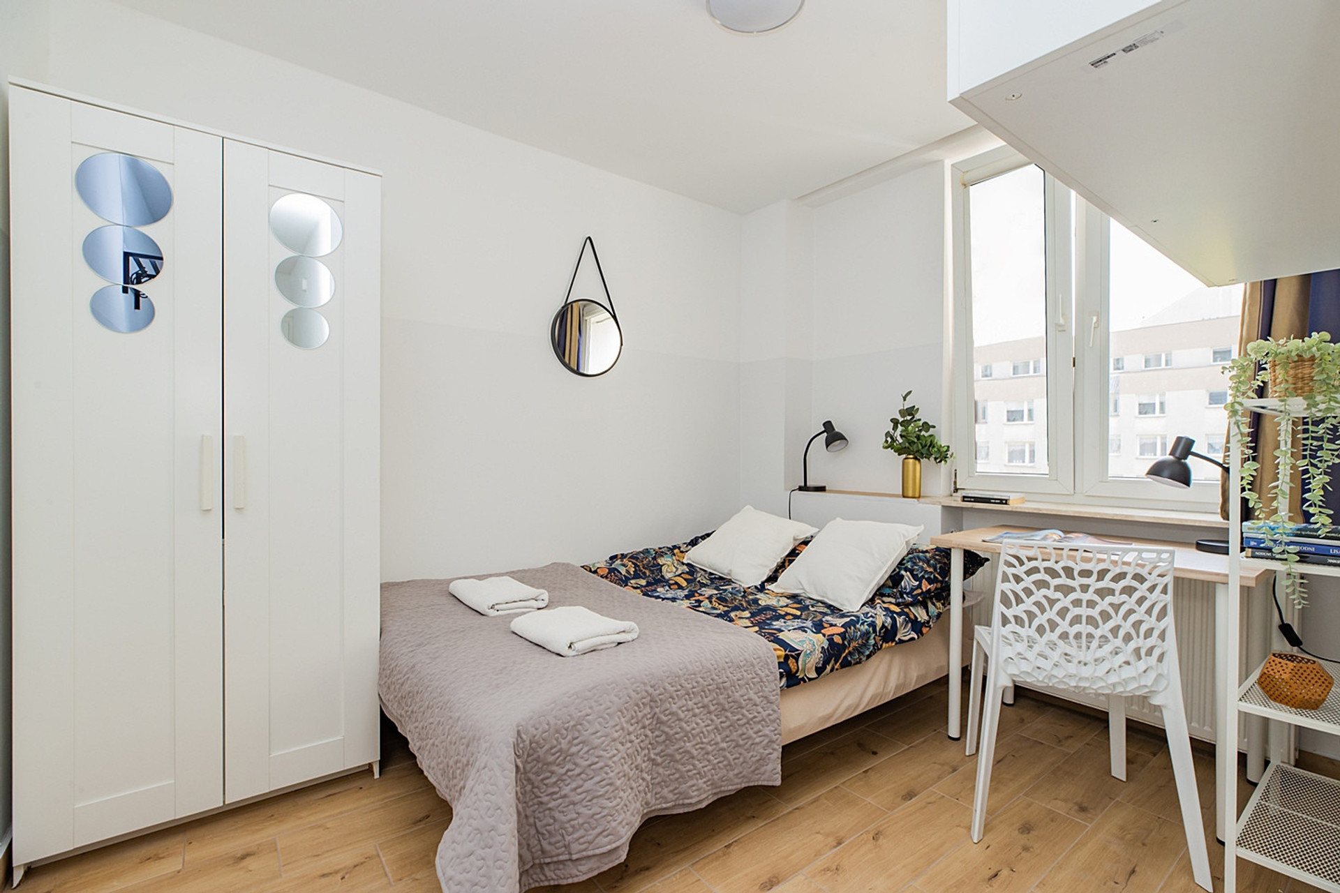 Bright bedroom with wardrobe and desk
