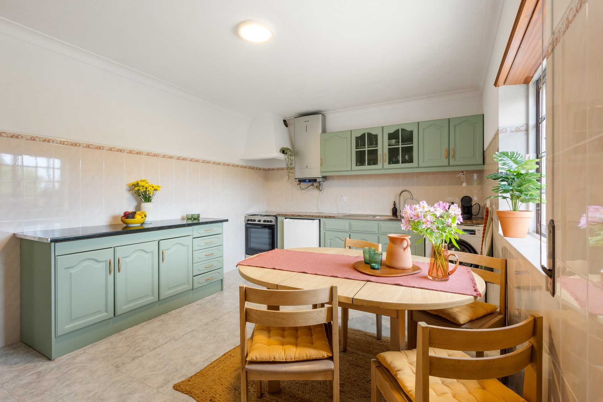 Kitchen with green cabinets