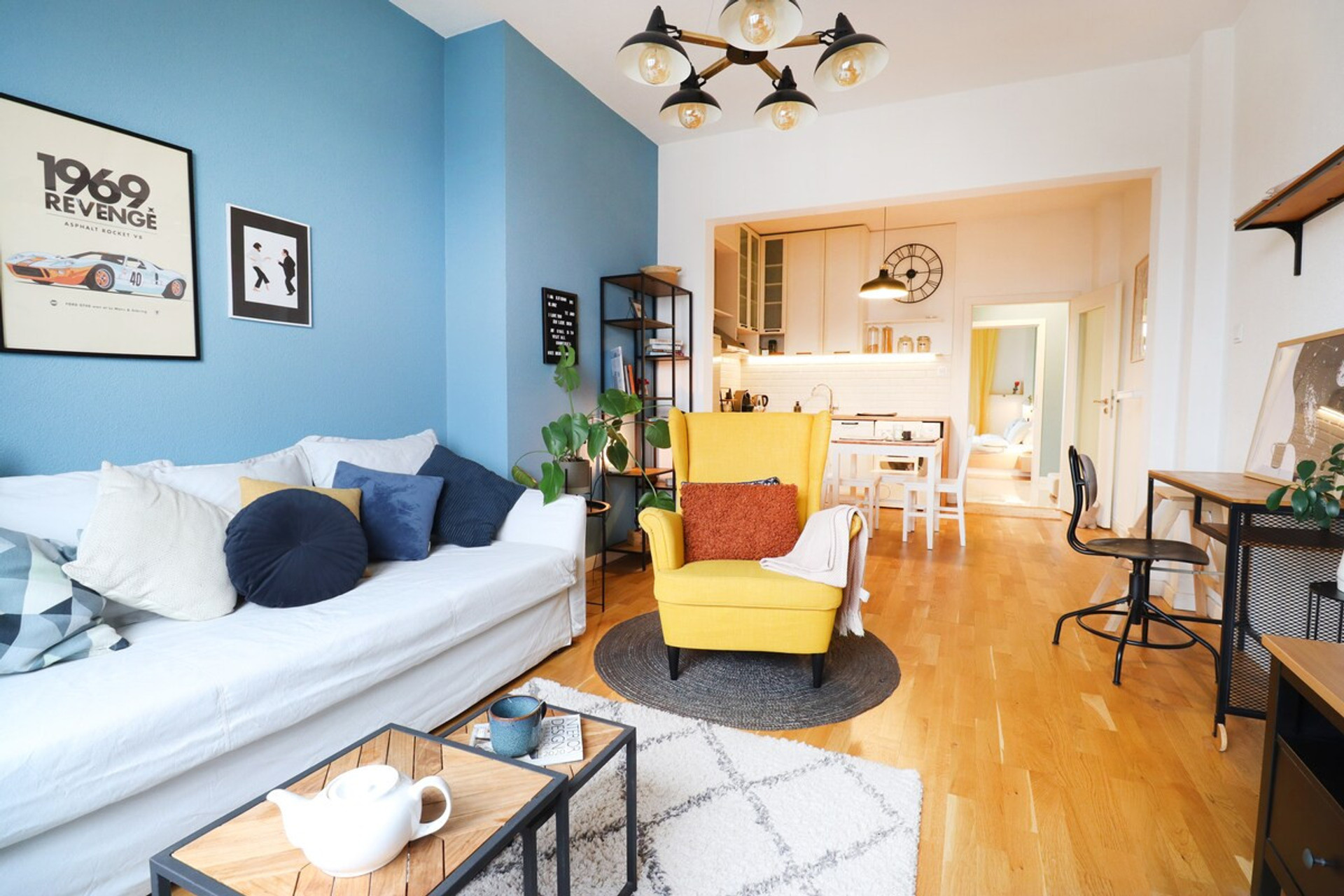 Cozy open living and kitchen area. Comfortable sofa and dedicated working space for your own comfort.