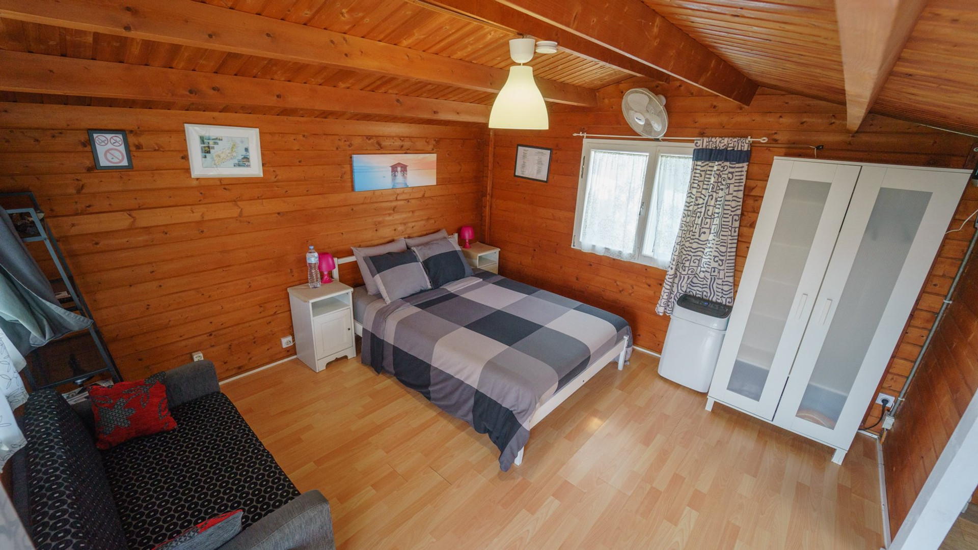 Bedroom with wardrobe and sofa