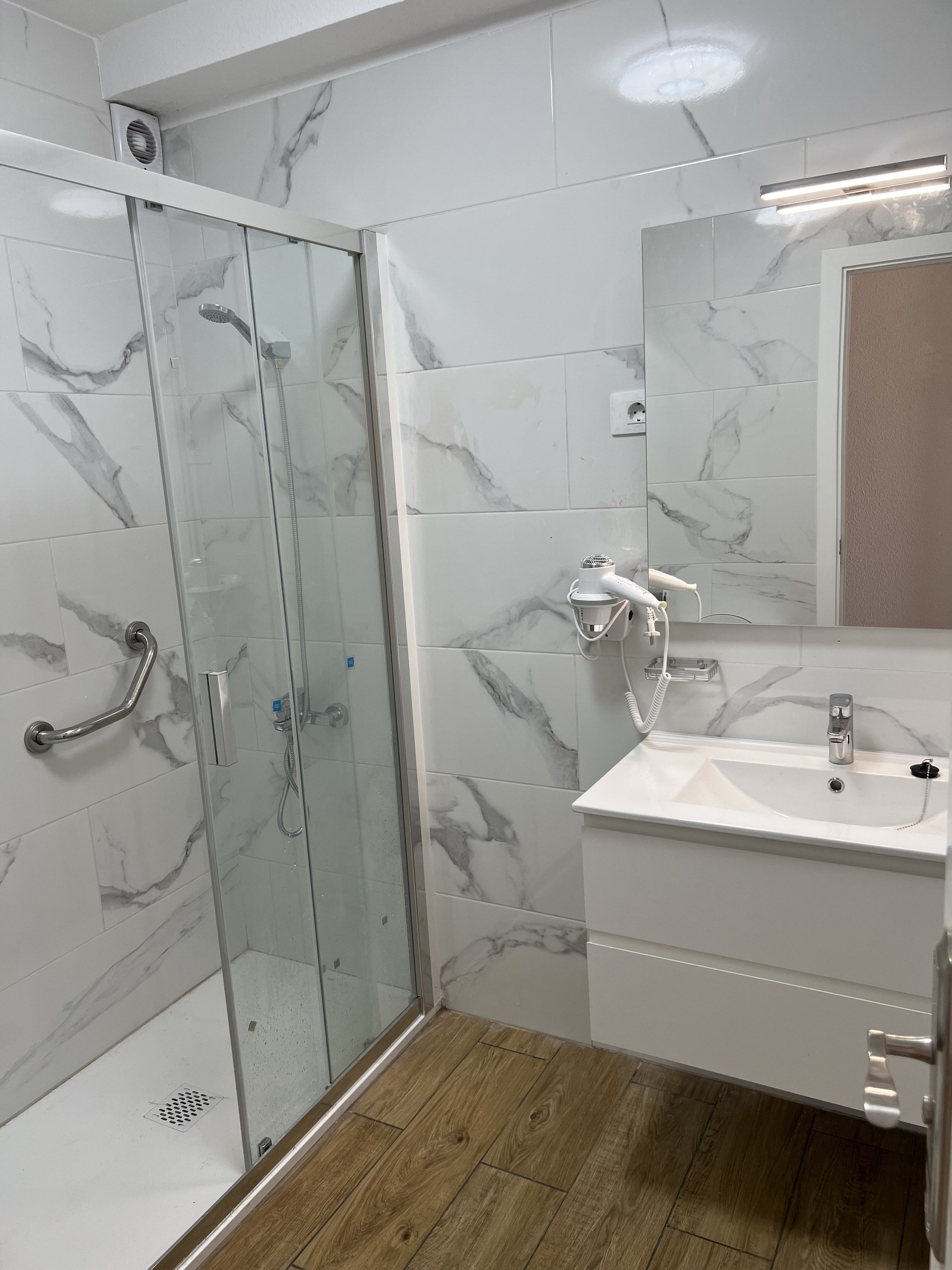 Marble bathroom with glass shower