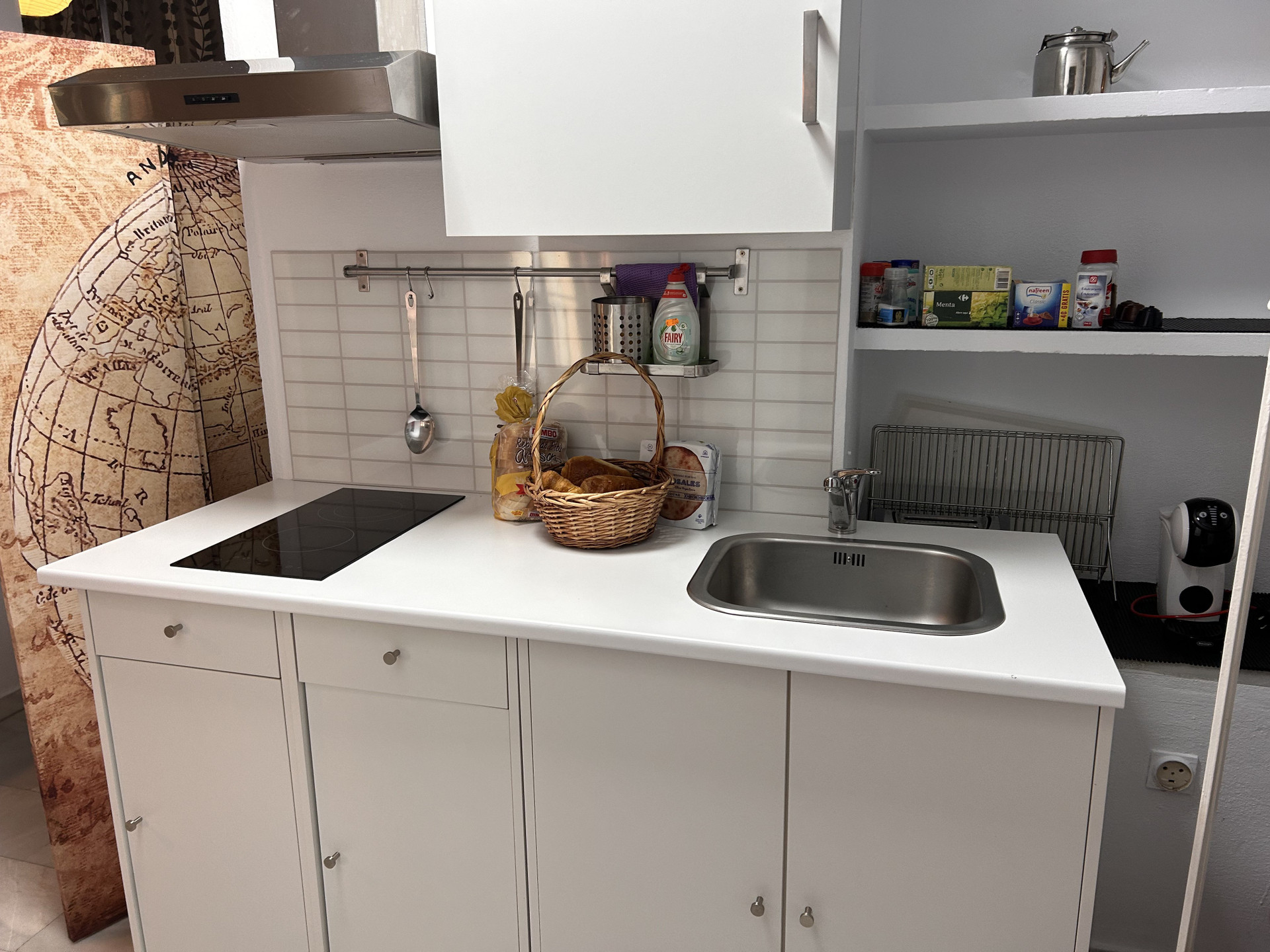 Compact white kitchenette