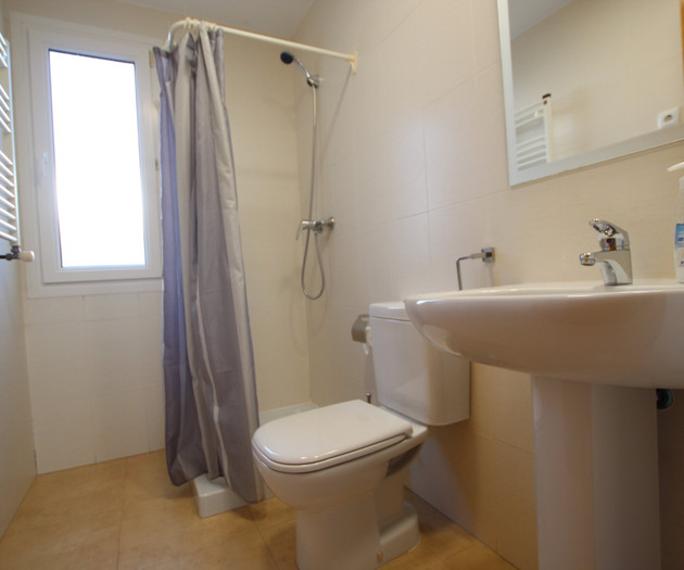 Bathroom with shower and sink