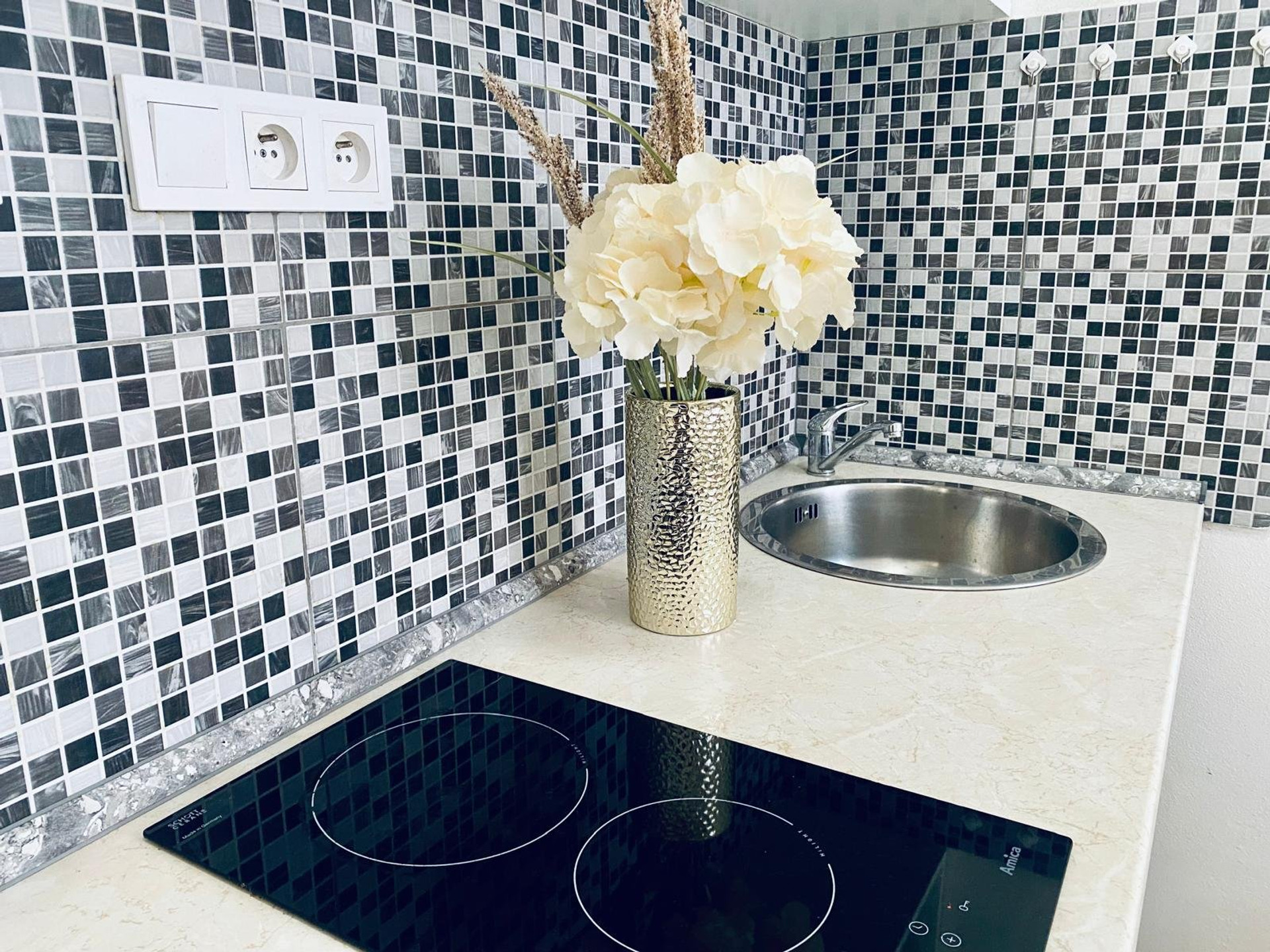 Kitchenette sink with mosaic tile
