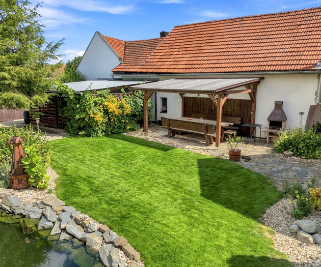 Landscaped garden with pergola and BBQ