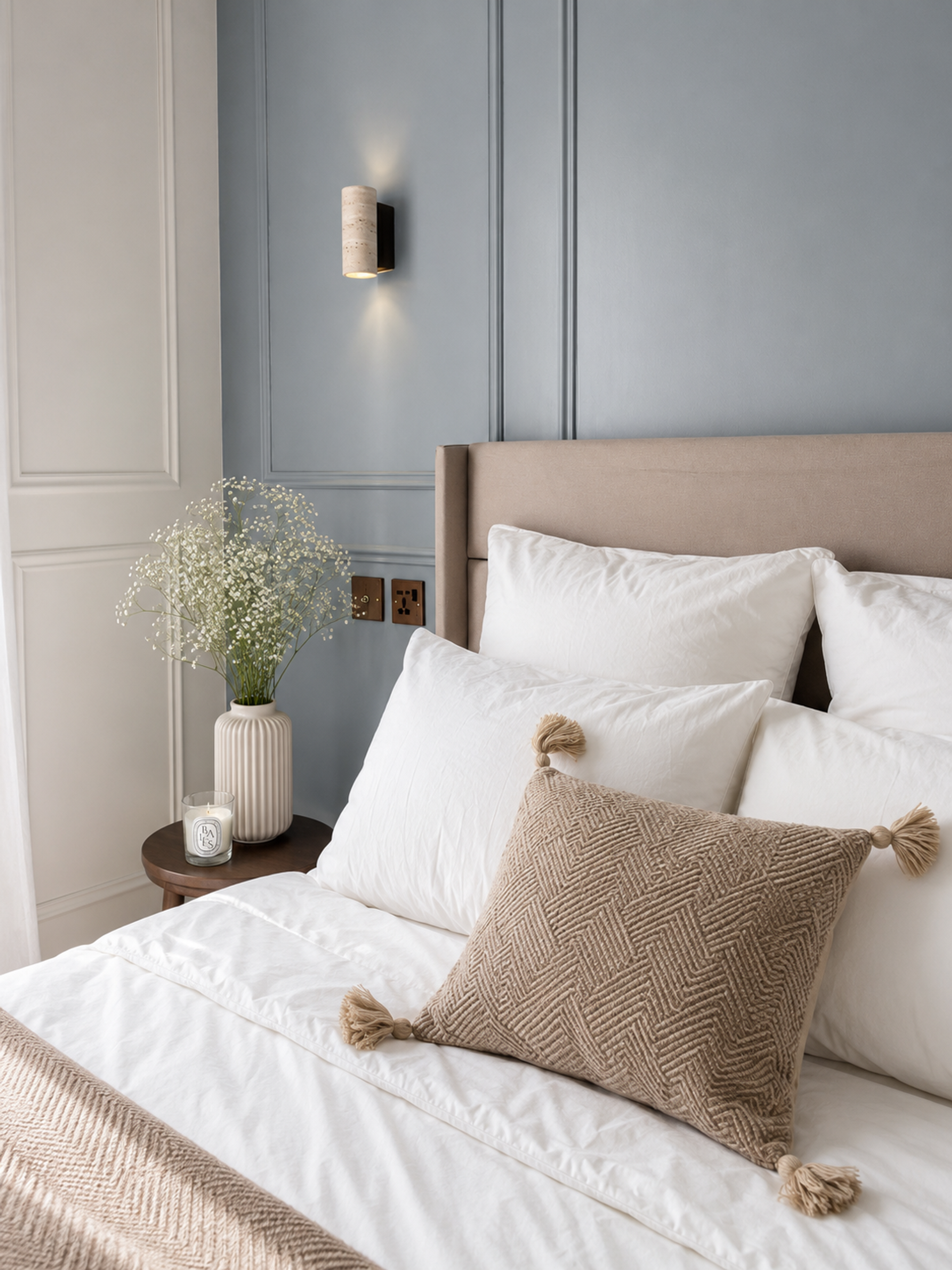 Close-up of bed pillows and nightstand