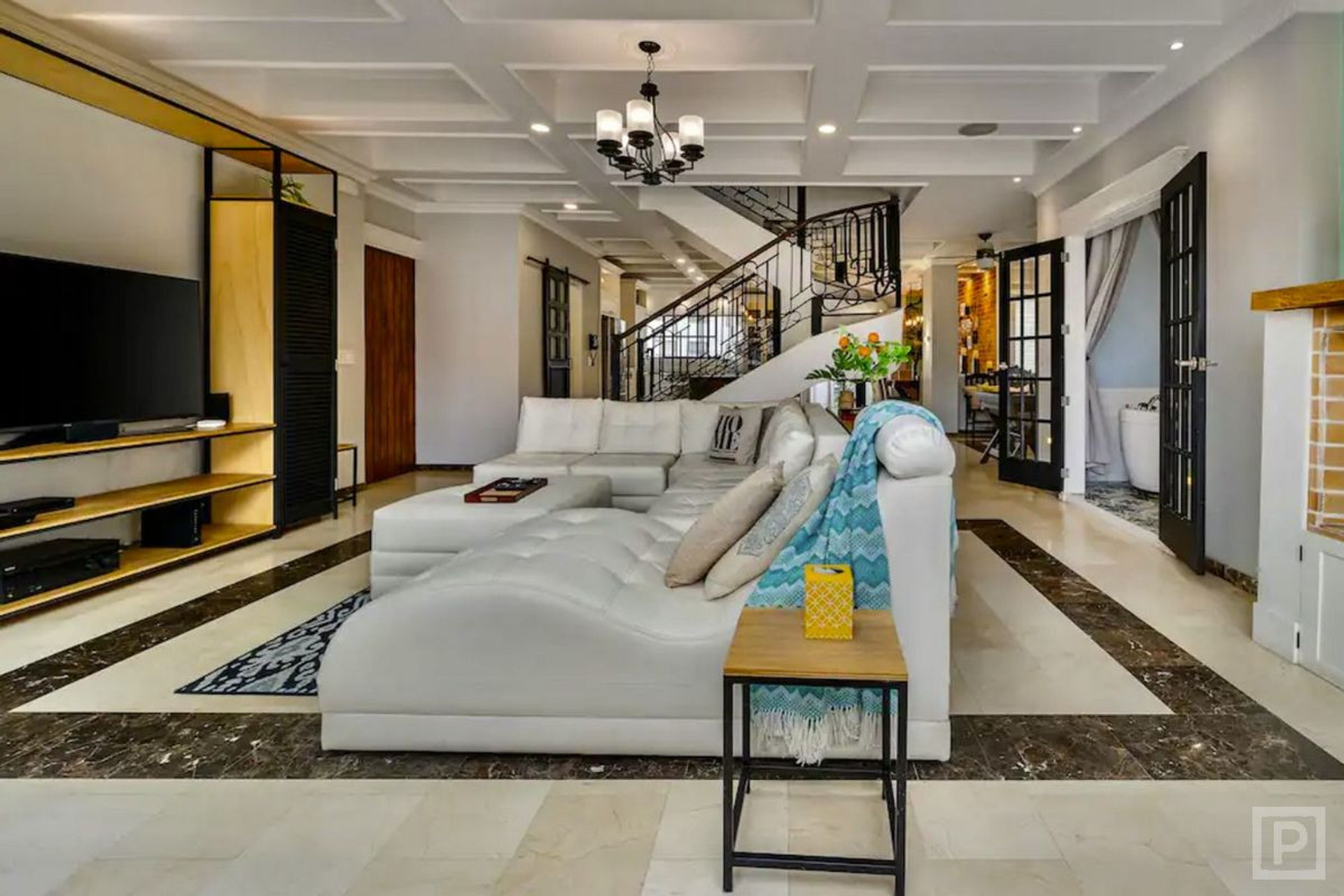 Main living room has wall-to-wall view windows, 65" 4k smart TV, surround sound home theater & more!