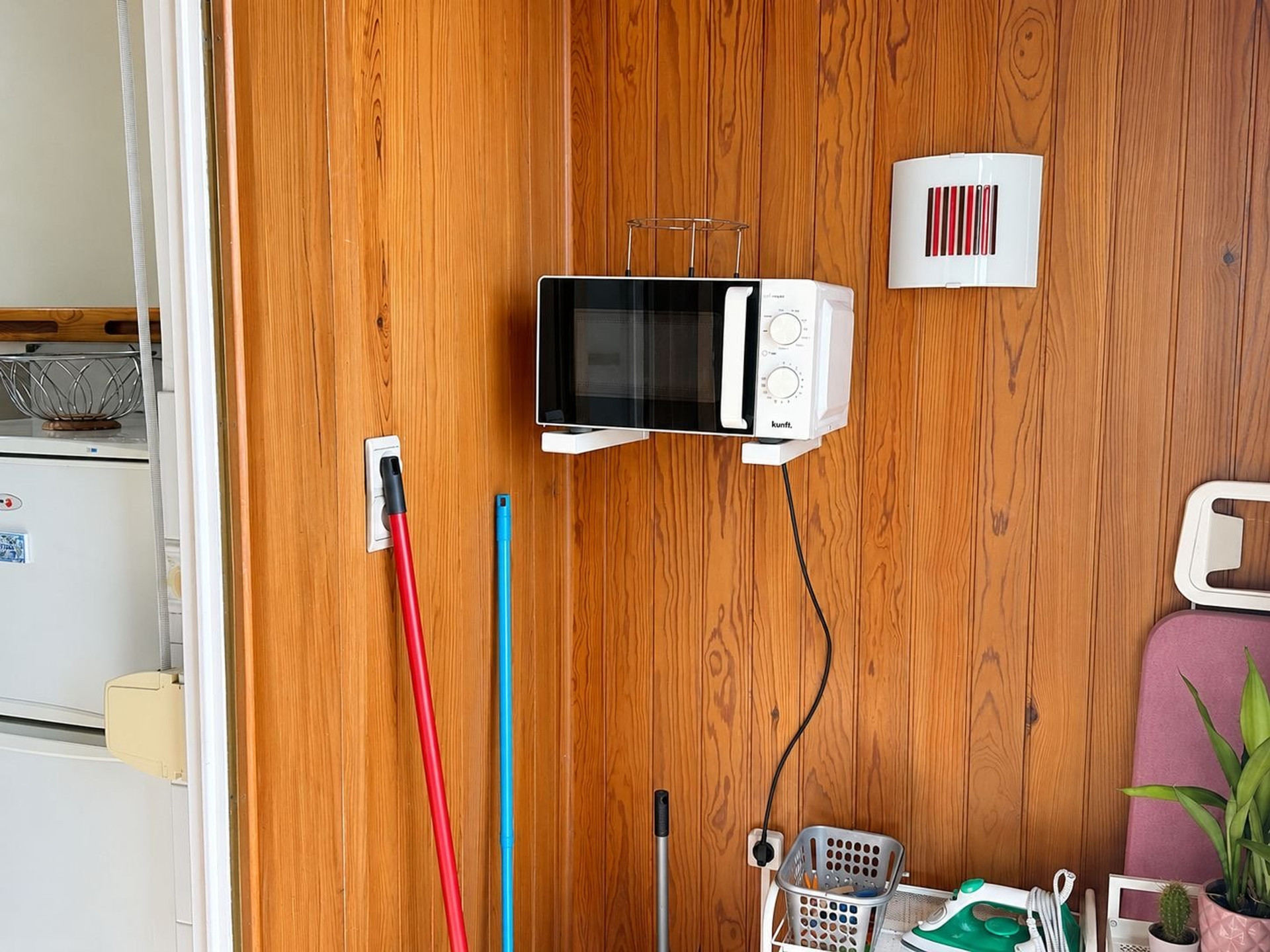 Enclosed porch with microwave and utilities