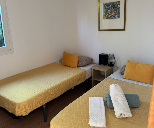 Twin beds with artwork