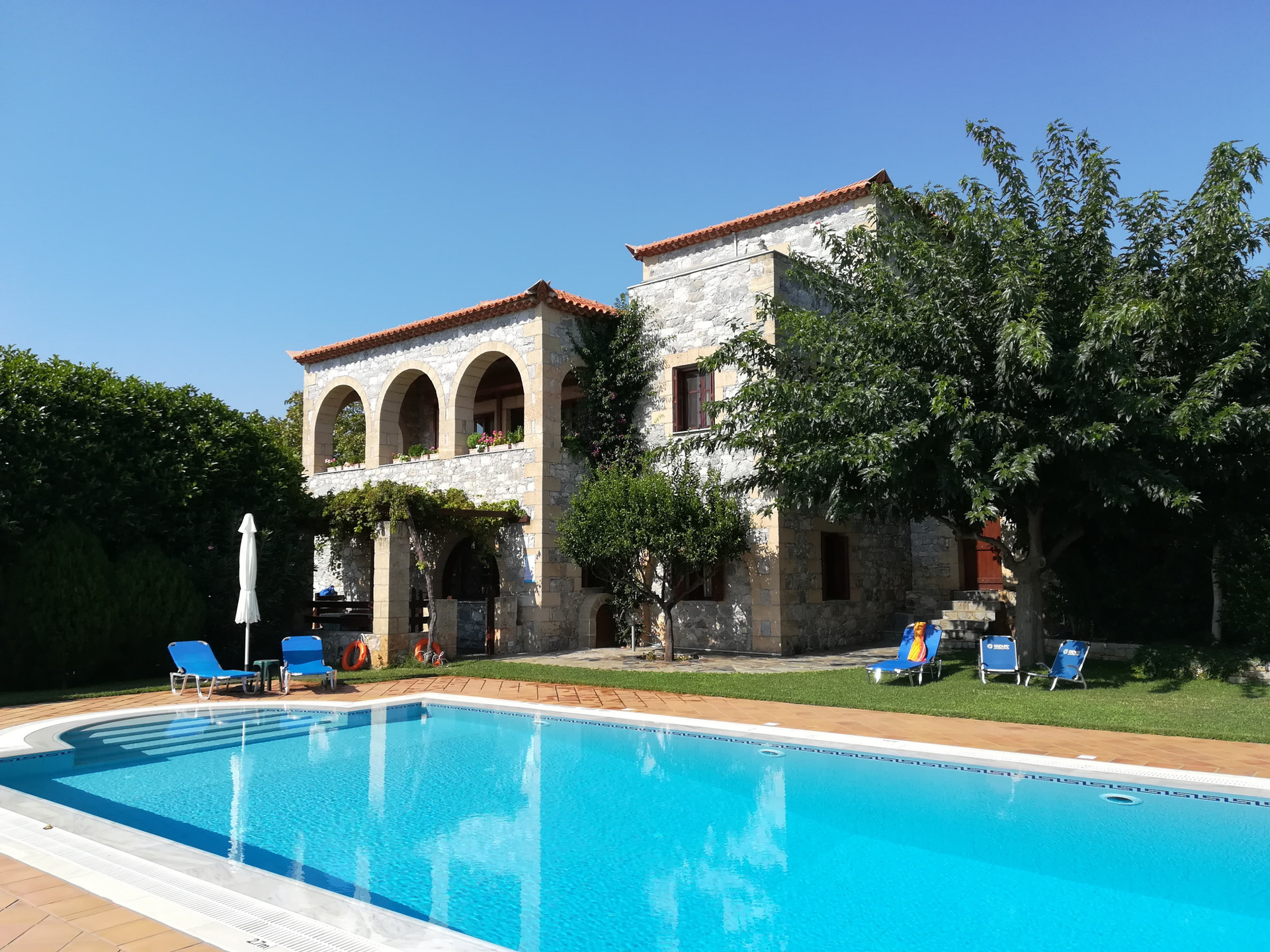Villa Sunset is complemented by a stunning, large, and deep pool, offering a luxurious outdoor escape. Surrounded by lush landscaping, it provides the perfect spot for relaxation and enjoyment.