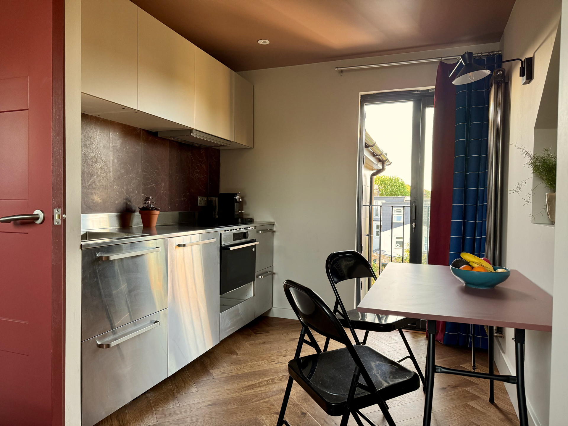 Kitchen with dining table and balcony