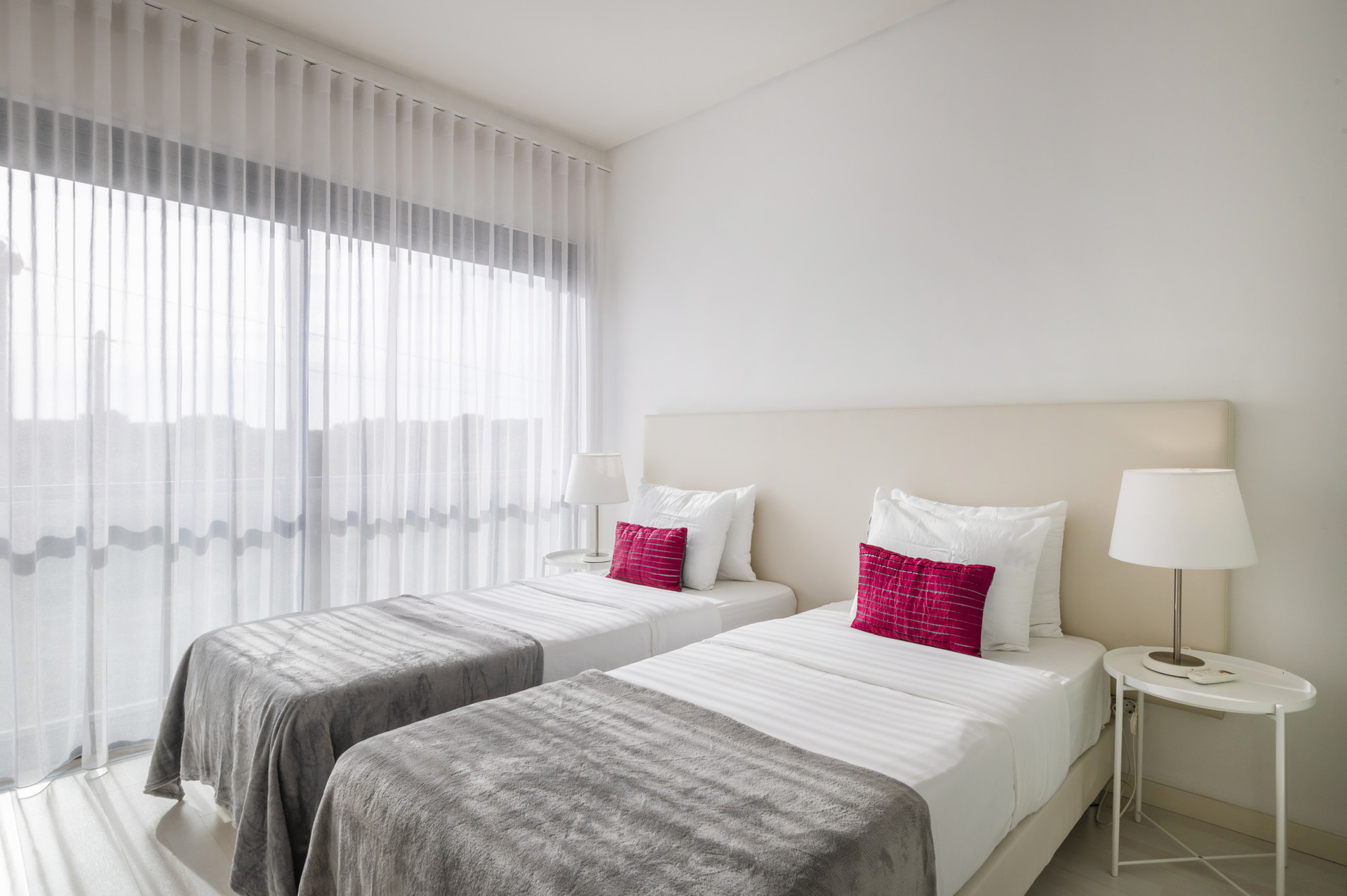 Bedroom with 2 single beds, wardrobe and AC