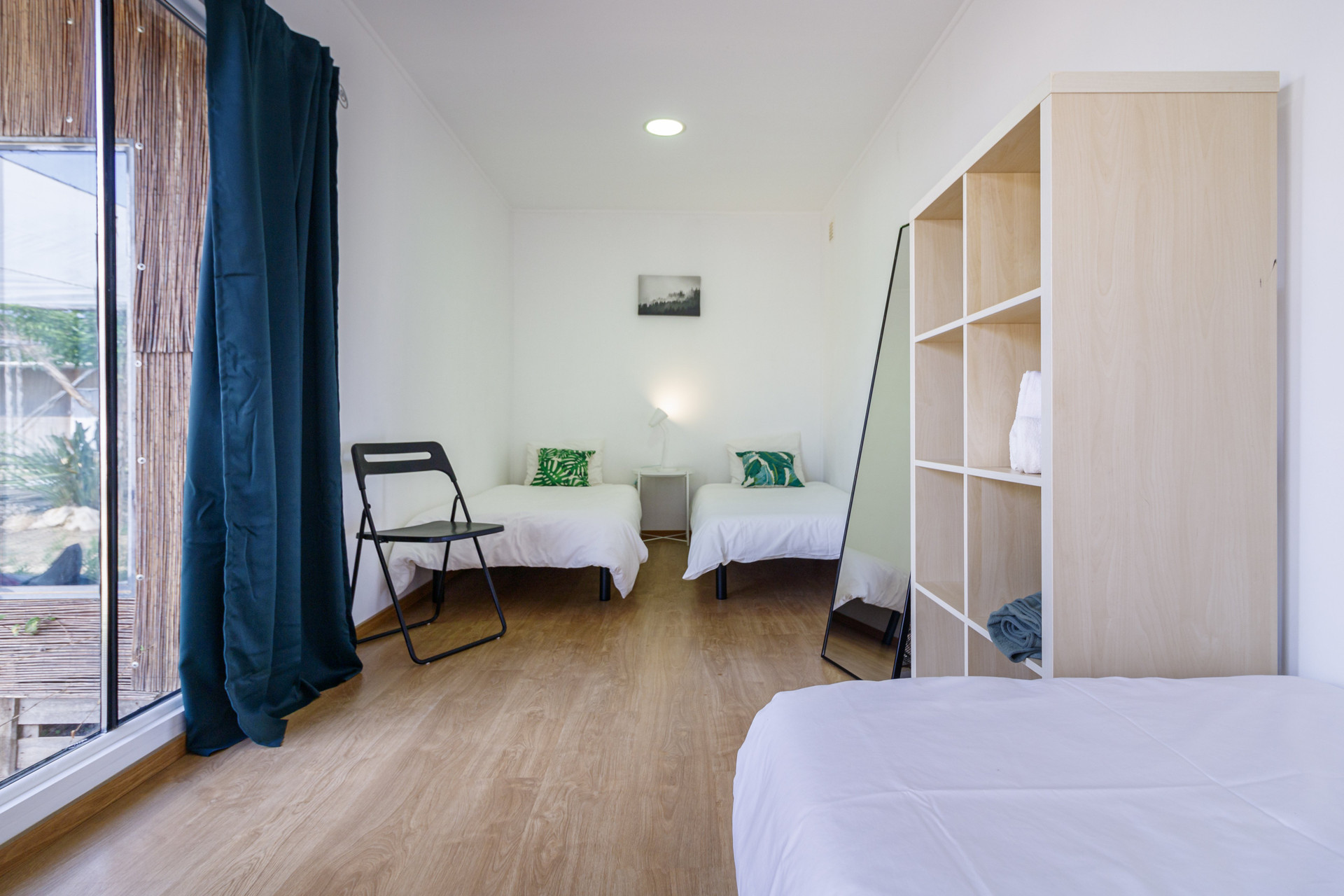Twin bedroom with large window