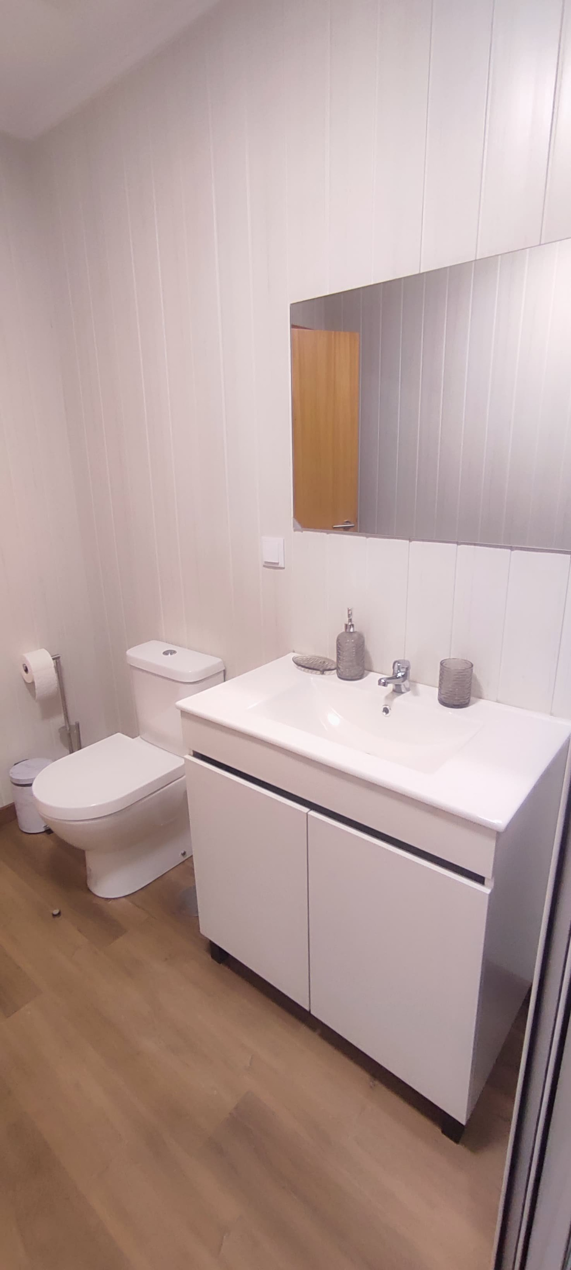 Clean white bathroom with vanity
