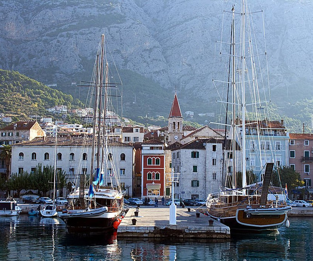 Marina with sailboats and mountains