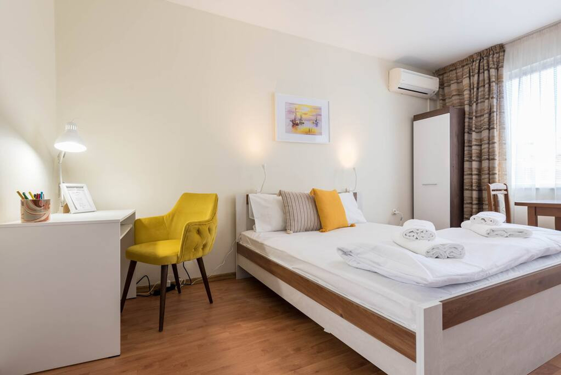 Spacious room with double bed and working space