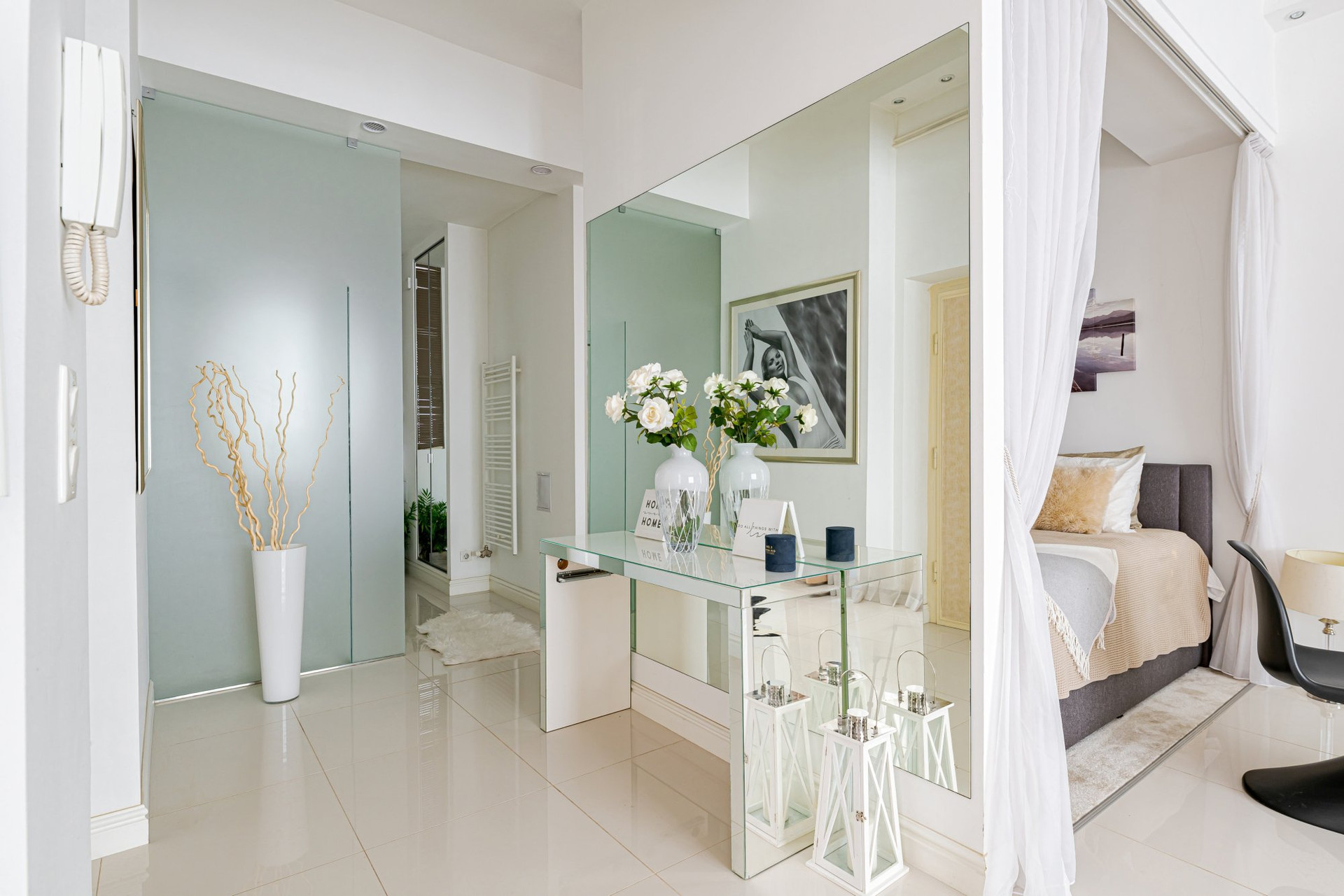 Hallway with bedroom and bathroom glimpse