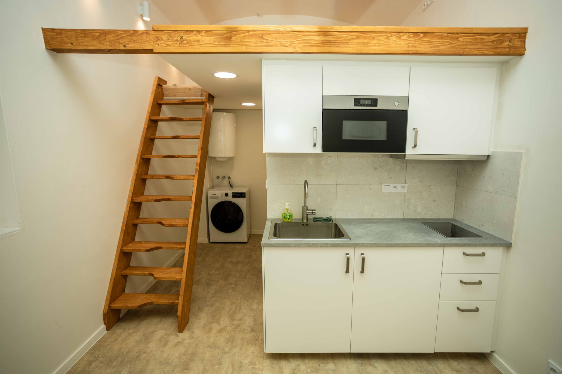 Kitchenette with loft stairs