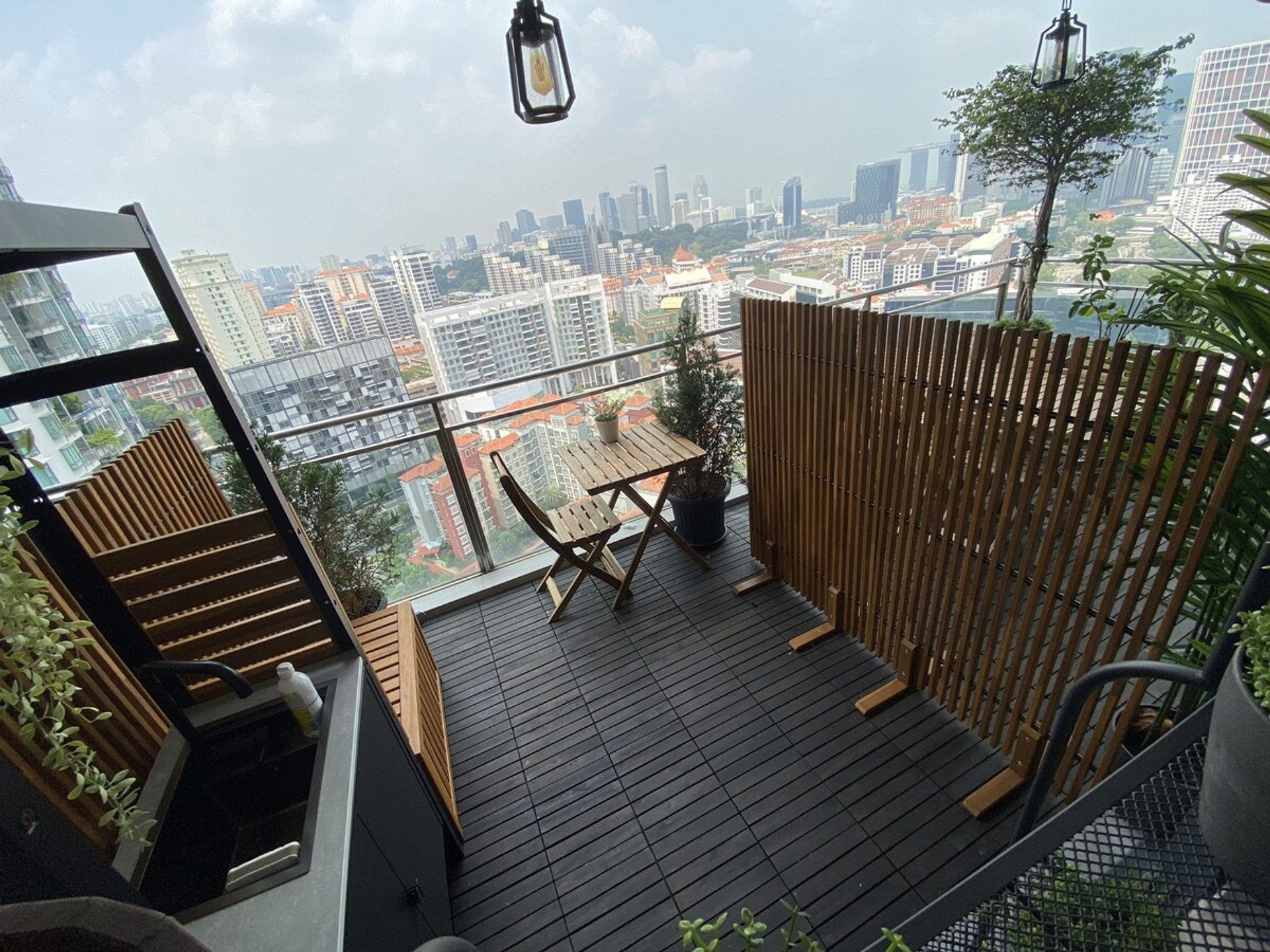 Personal balcony with outdoor seats and dining table - comes with washing point, basin, and power outlet all for your exclusive use while surrounded by your "Top of the World" views.