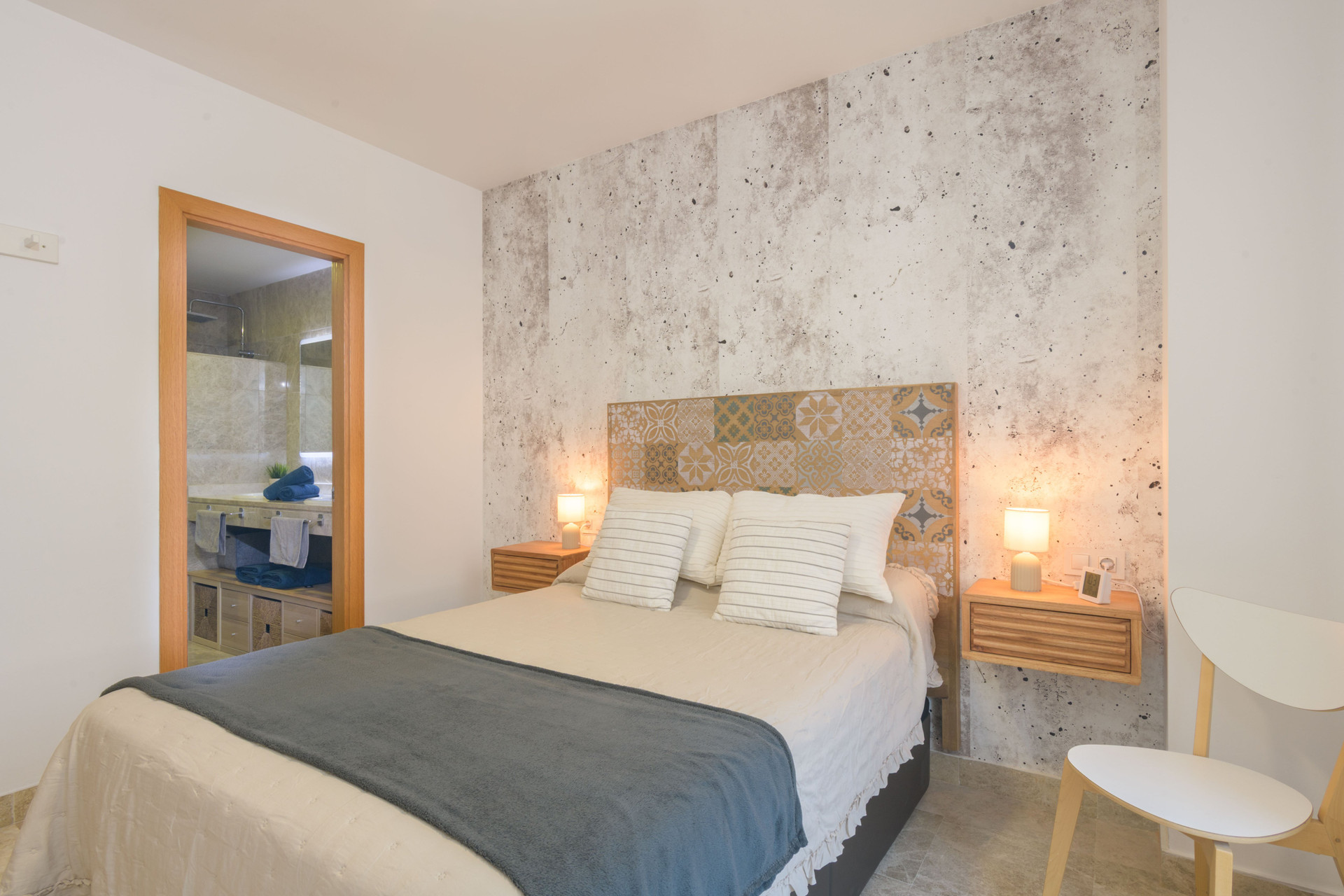 Bedroom with patterned headboard