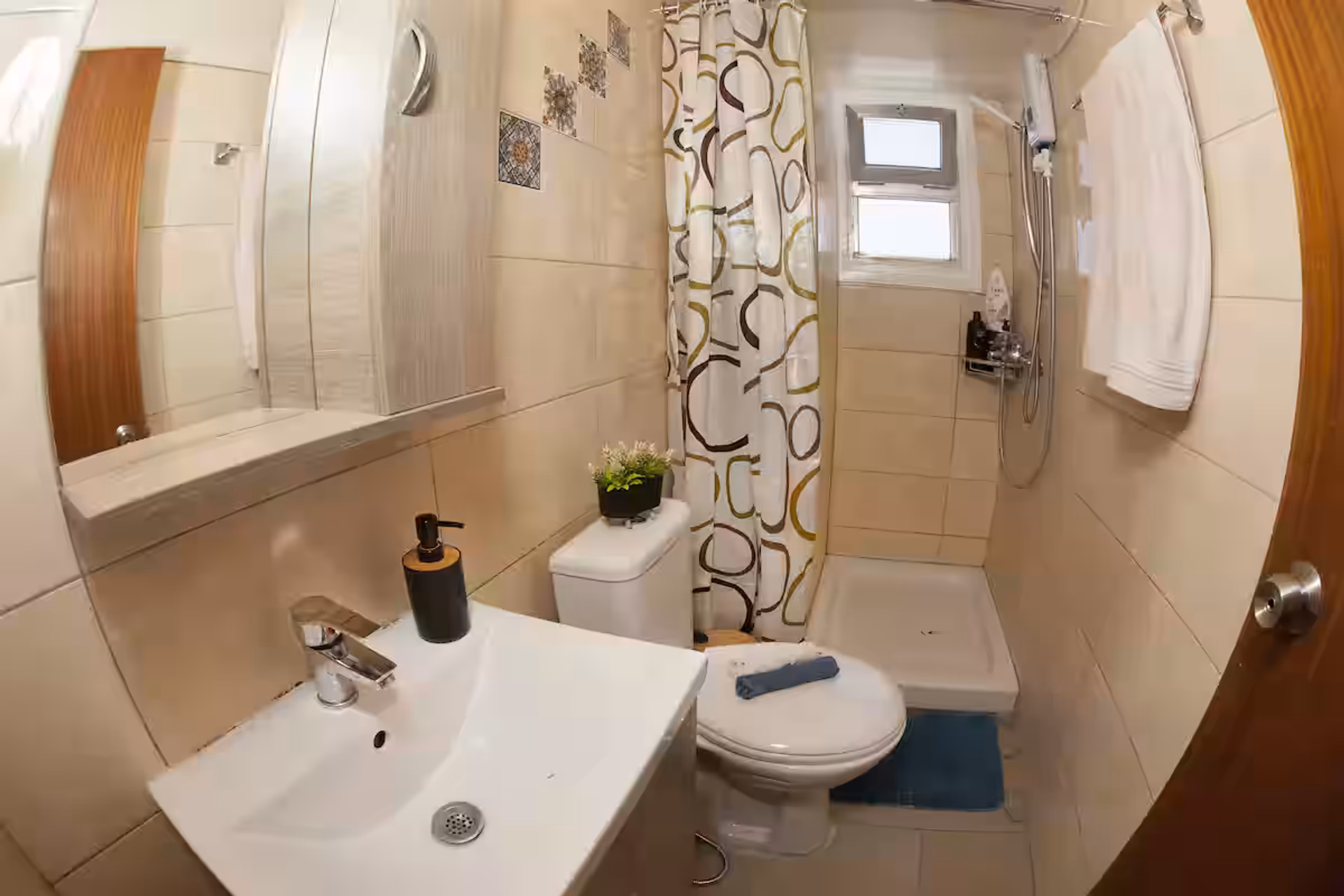 Bathroom with shower and sink