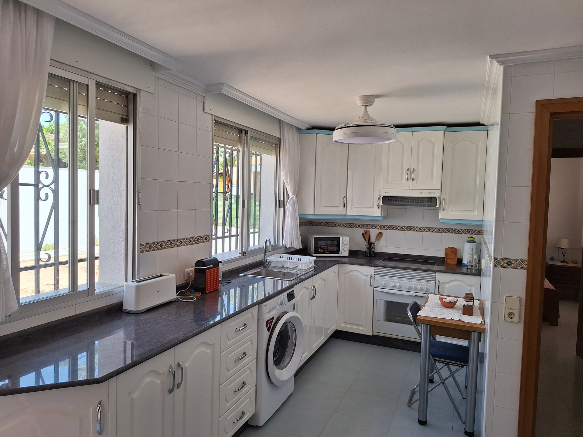 Kitchen with white cabinets appliances