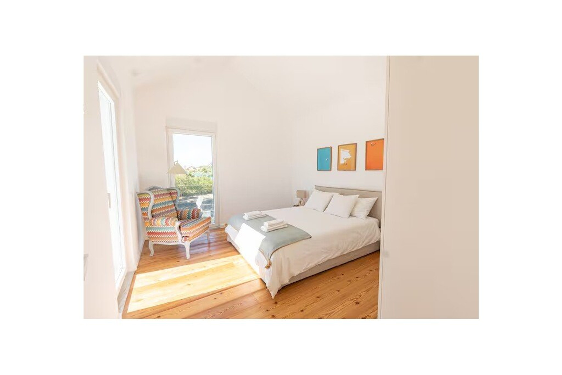 Bright bedroom with colorful art