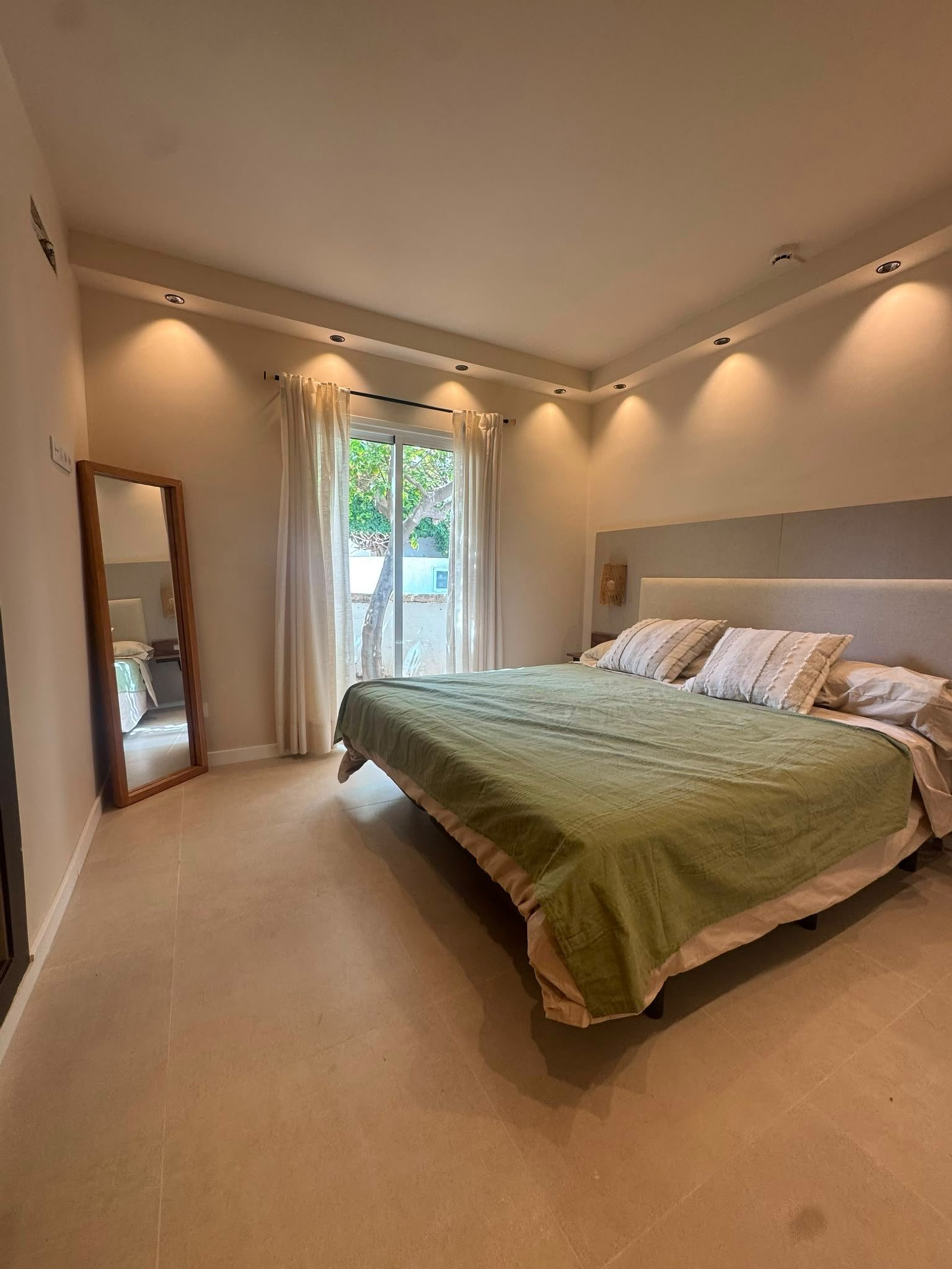 Spacious bedroom with garden view