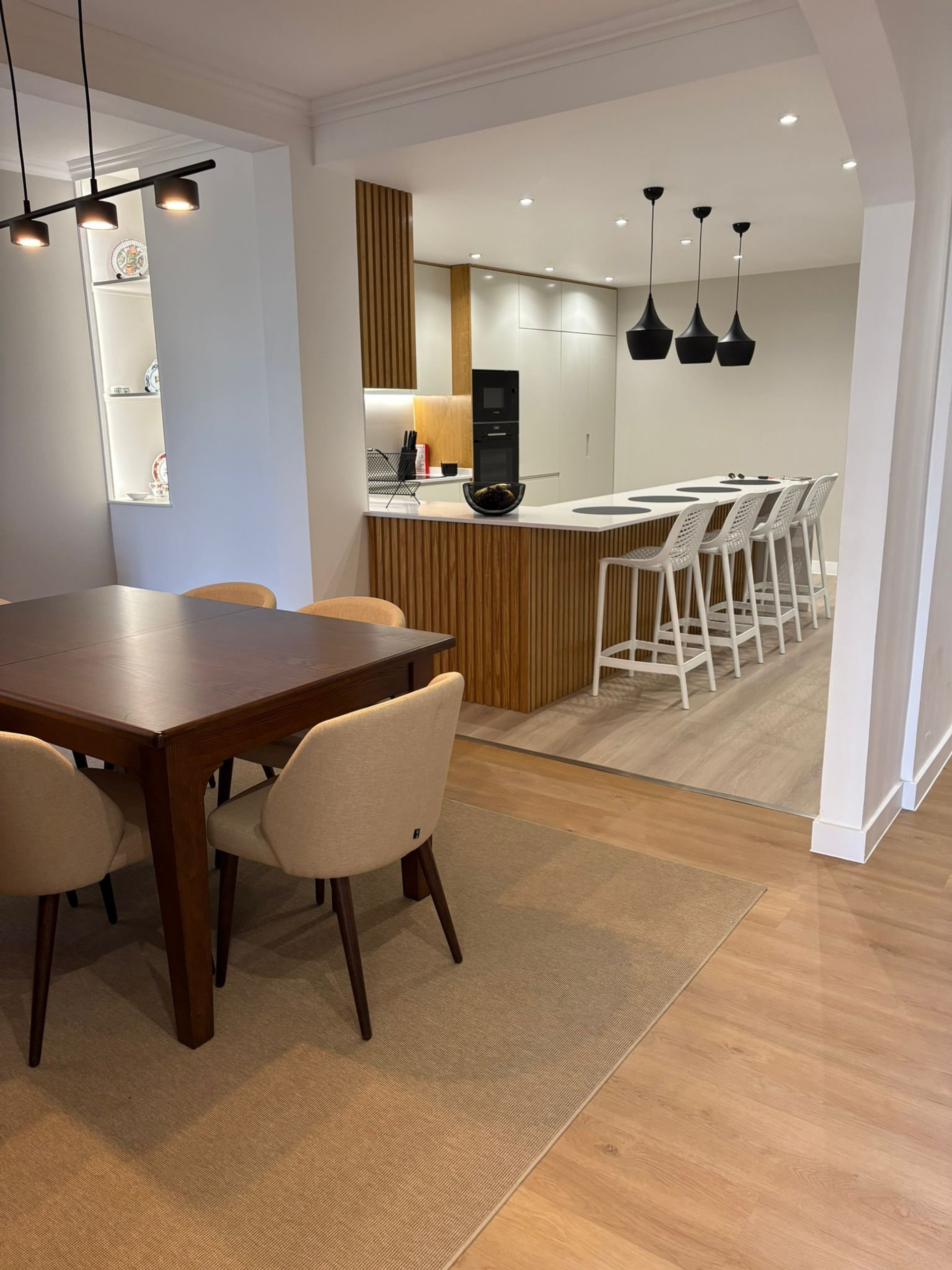 Dining table with kitchen backdrop