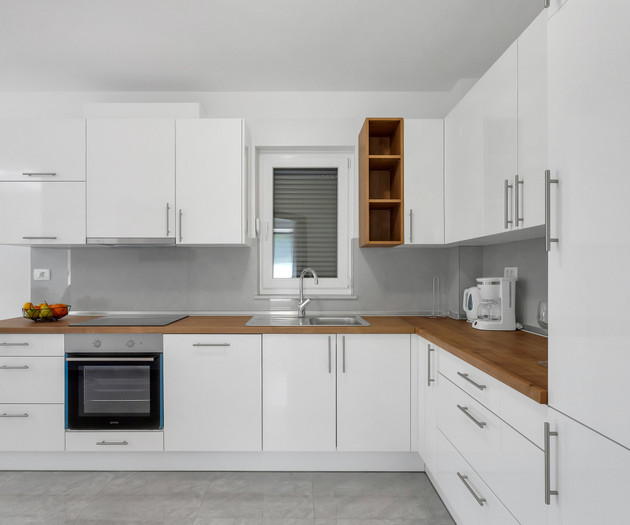 White kitchen with wood counters