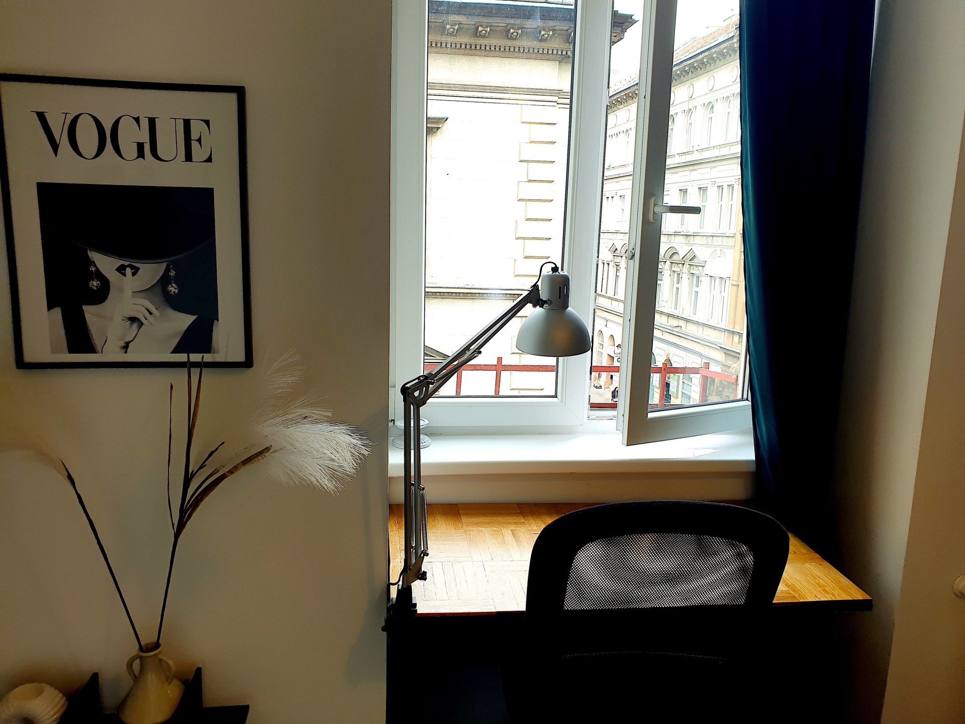 Desk, office chair and sunny street view 