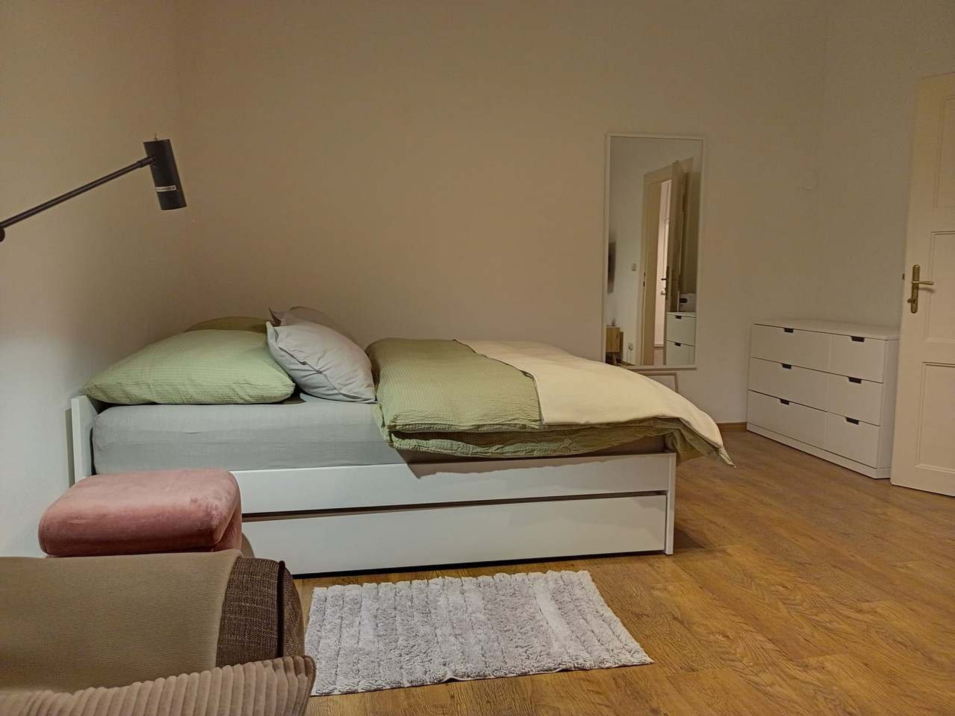 Bedroom with double bed dresser
