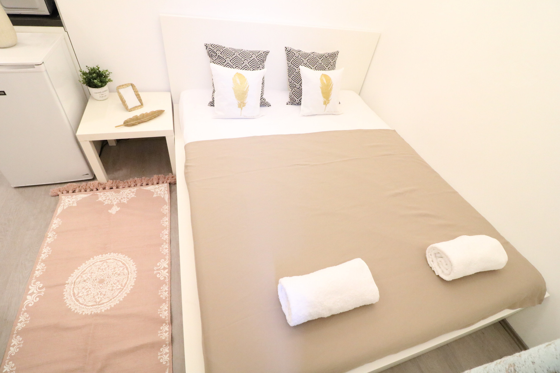 Bed with decorative pillows