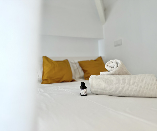 Bedroom bed with towels detail