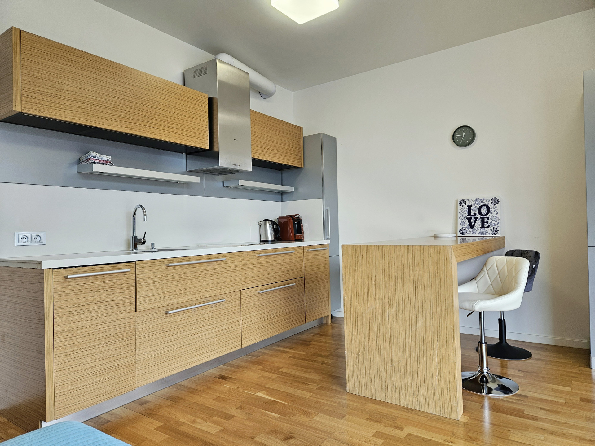 Kitchen with wood cabinets and bar