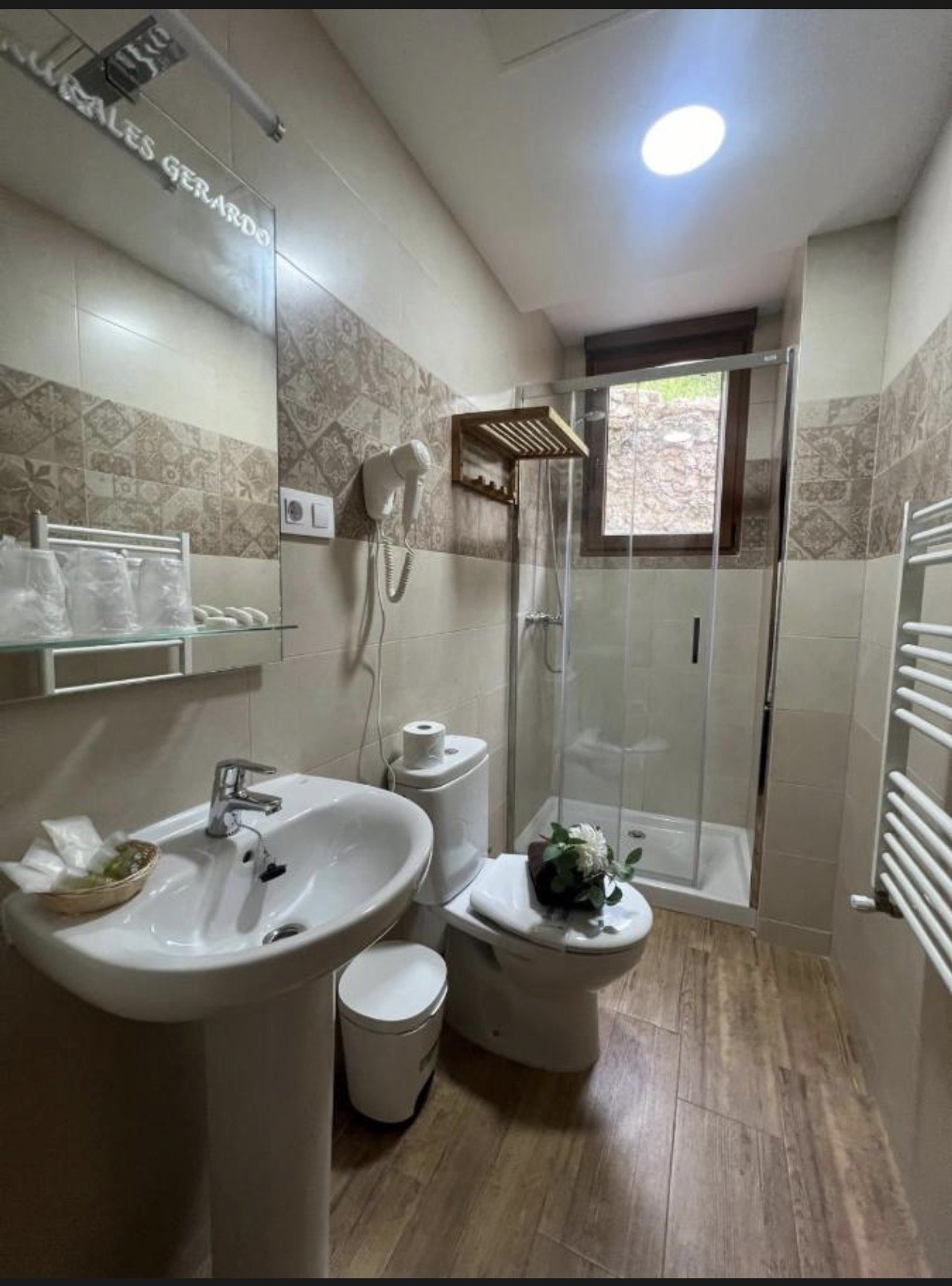 Bathroom with shower and pedestal sink