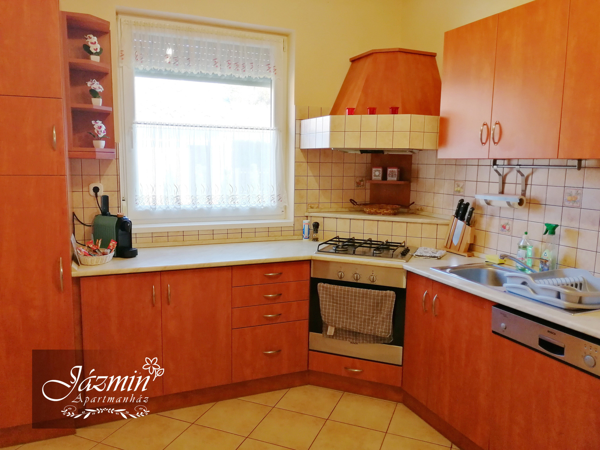 Kitchen with wooden cabinets and oven