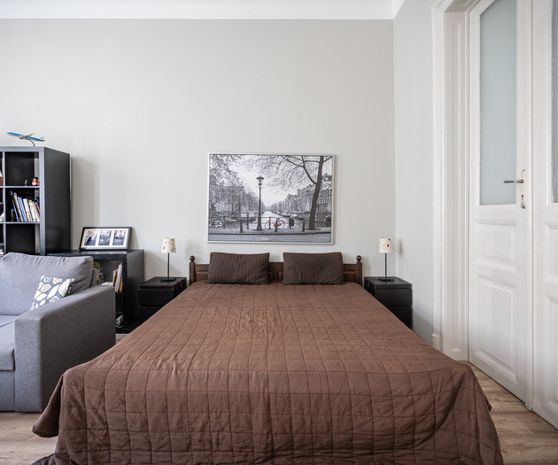 Bed and sofa in living area