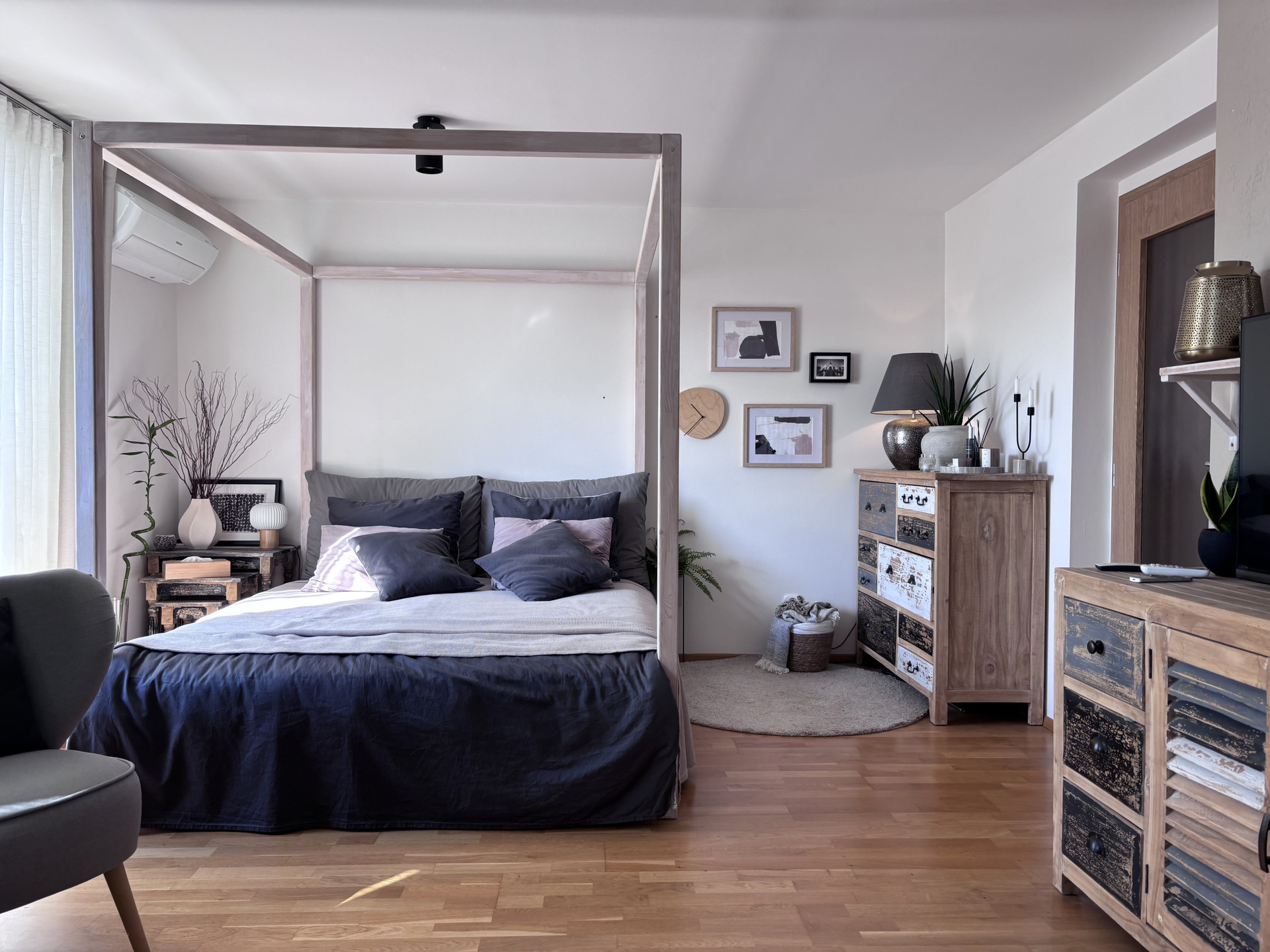 Bedroom with dresser and art