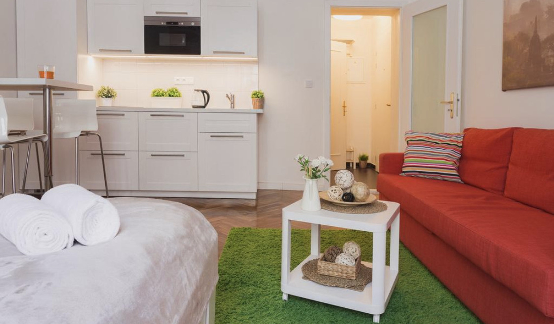 Open studio with kitchen and sofa