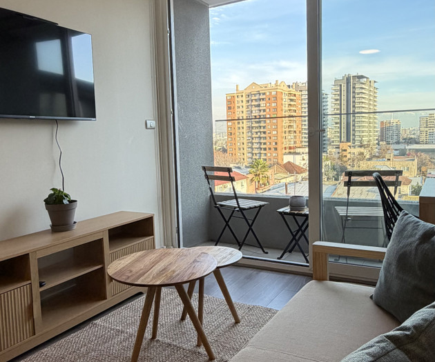 Living area with TV and balcony