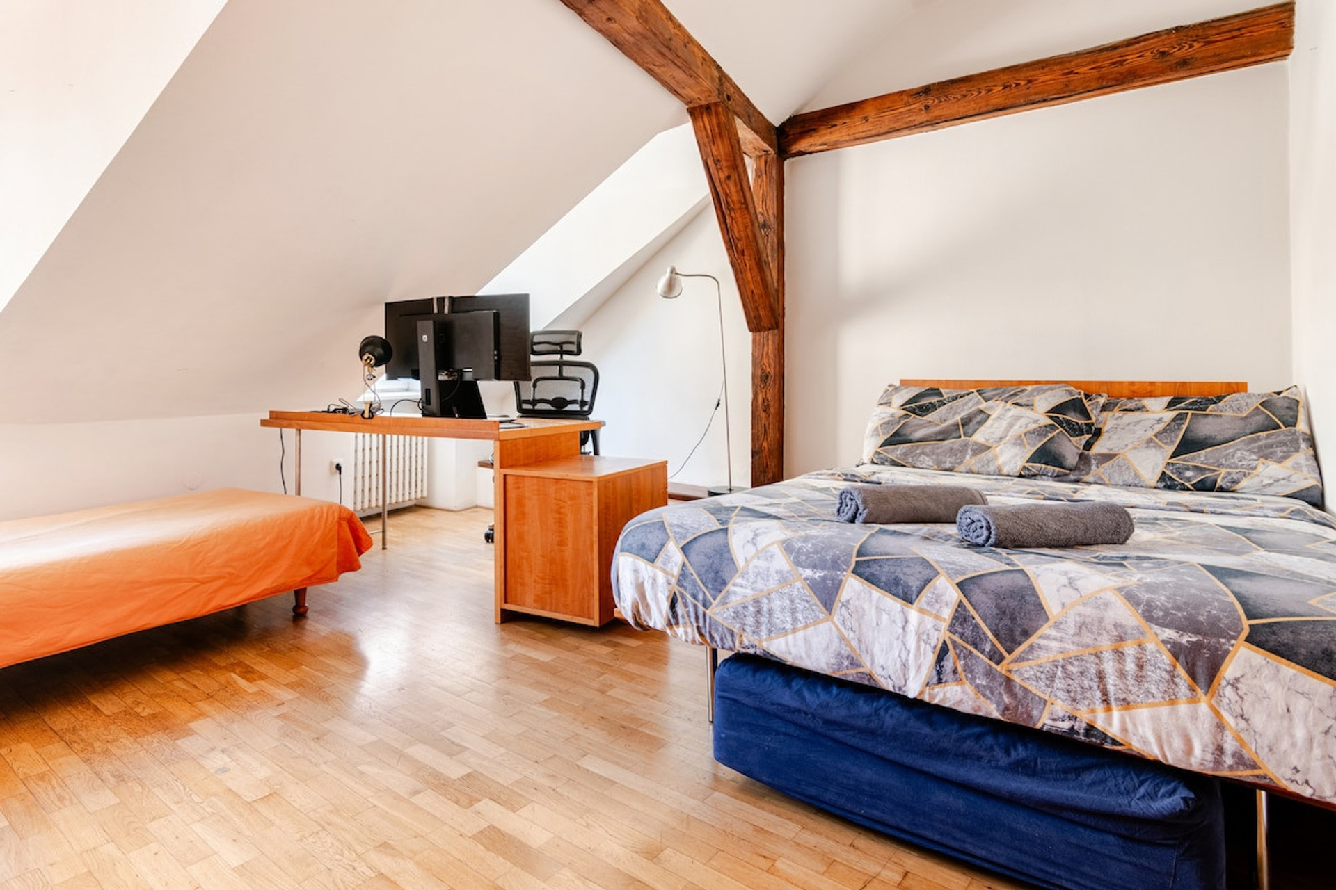 there is a single bed (under the double bed) which can slide out and sleeps additional 1 person. 