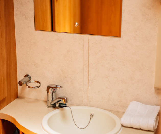 Compact bathroom sink with mirror